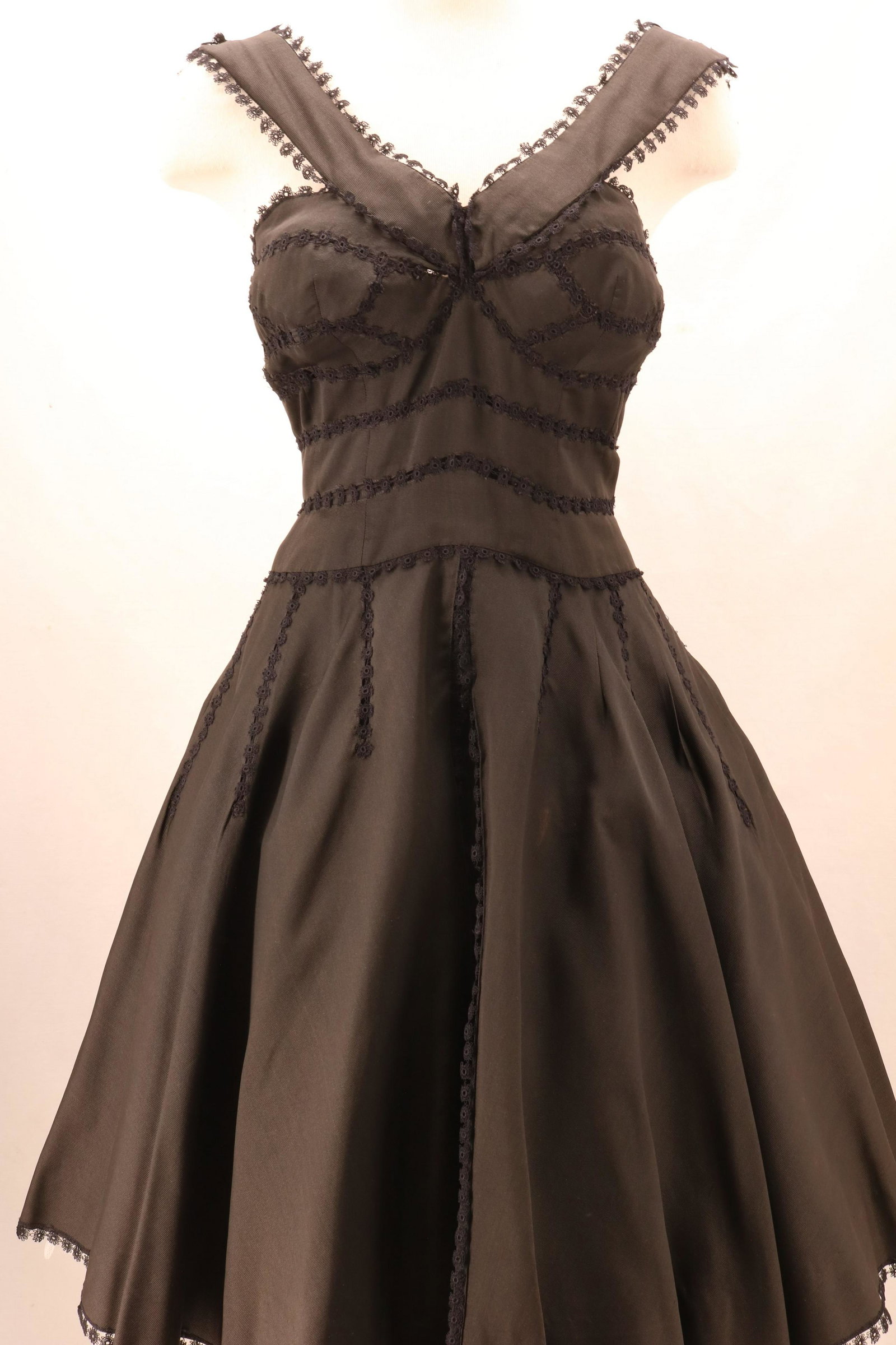Vintage 1950's Miami Beach JOAN ABBOTT Original Black: Vintage 1950's Miami Beach JOAN ABBOTT Original Black Party Dress in rayon blend with lace accents throughout. Interesting tailoring on this piece with notches at the top of the straps, hidden pleat d