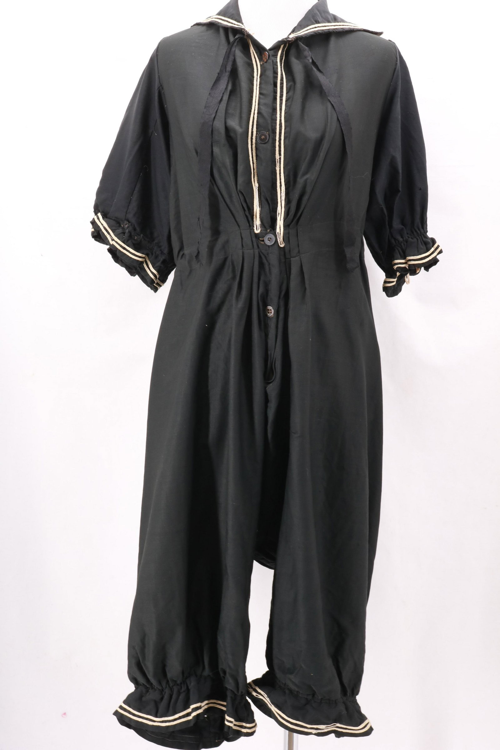 Victorian Woman's Sailor Style Bathing Suit: Victorian Woman's Bathing Suit in remarkable condition for the age. Grosgrain ribbon tie at the neck, elasticized gathering at the hem and cuff edges. Sailor styling with contrast piping at the collar
