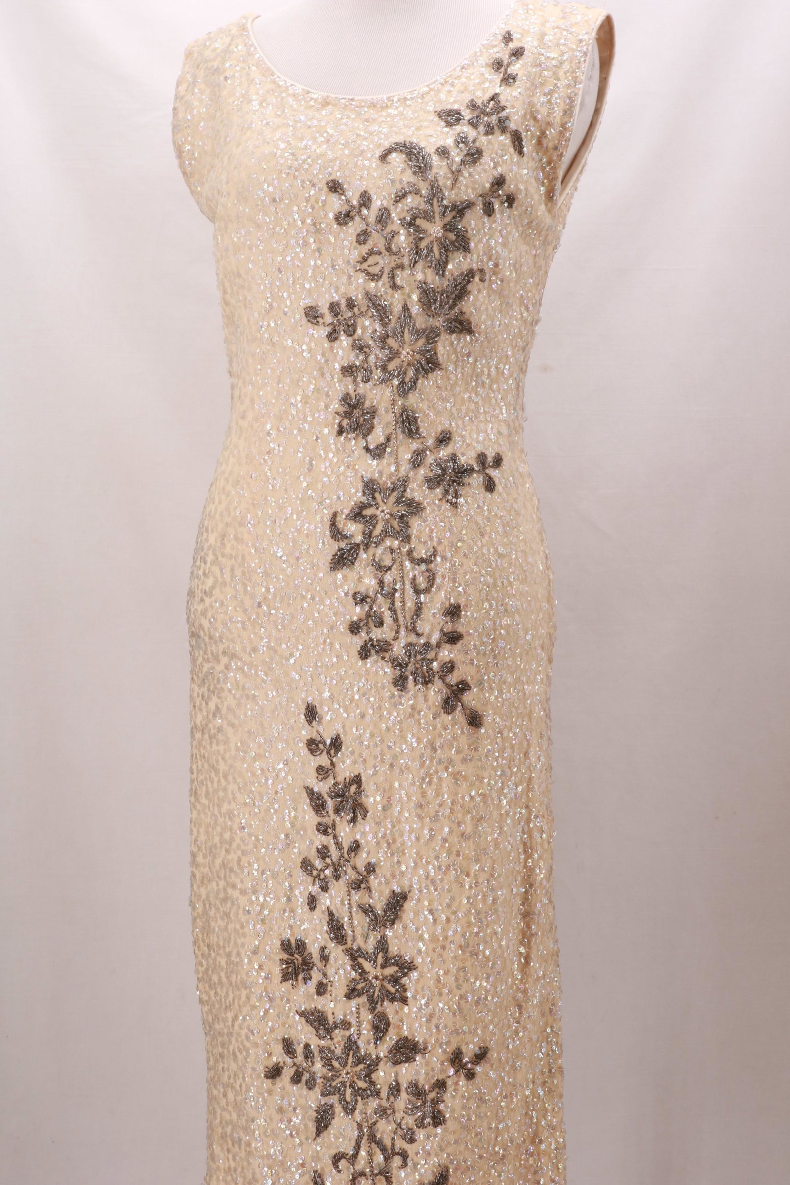 Vintage 1950's/60s Sequined Knit Wiggle Dress with: Vintage 1950's/60s Sequined Knit Wiggle Dress with Asian Motif. In the style of Gene Shelly. Metal side zip opening and fully lined with white satin. Approximate measurements: Bust 36", Waist 27", Len