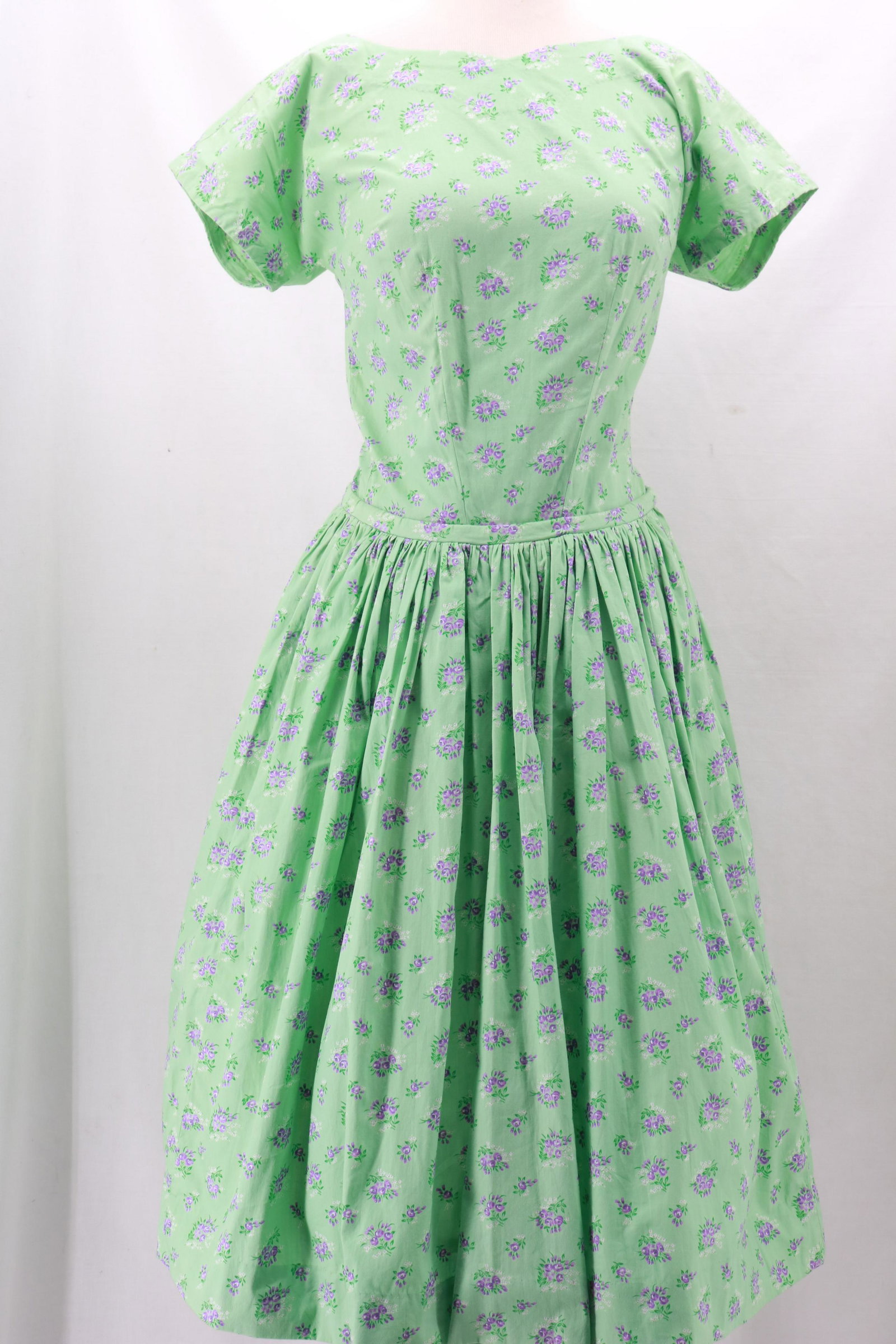 Vintage 1960s Floral Cotton Dress: Vintage 1960s Floral Cotton Dress with full, gathered skirt, sweetheart neckline and short sleeves. Green background is set off with lovely lavender flowers throughout. 15" zip closure at the back. Ap