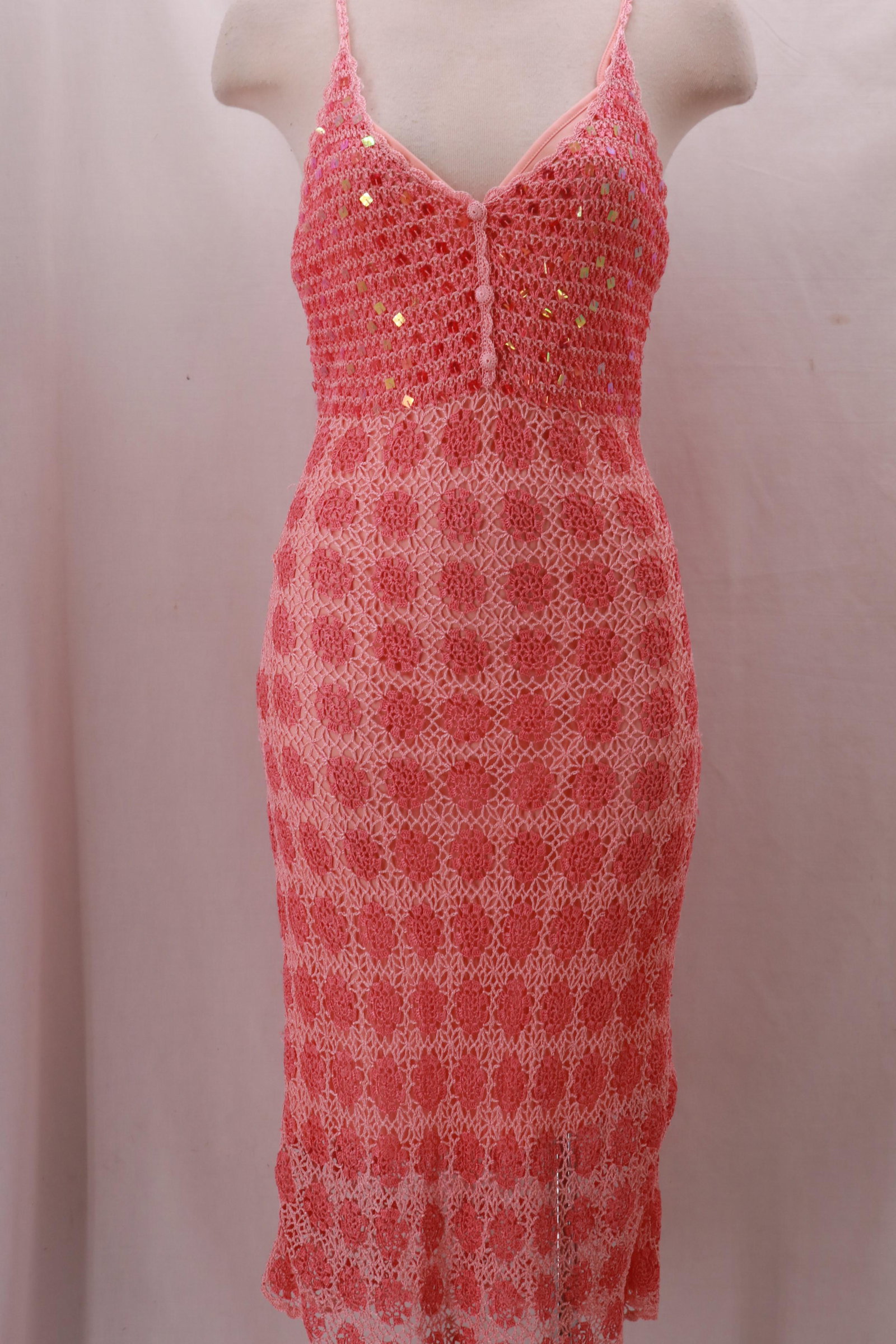 Vintage 1970's Strappy Peach Crochet Maxi Dress with: Vintage 1970's Strappy Peach Crochet Maxi Dress with Sequin Accent and fully lined in nylon matching color. Button detail at the front center bodice. Excellent condition. Approximate measurements: Bus