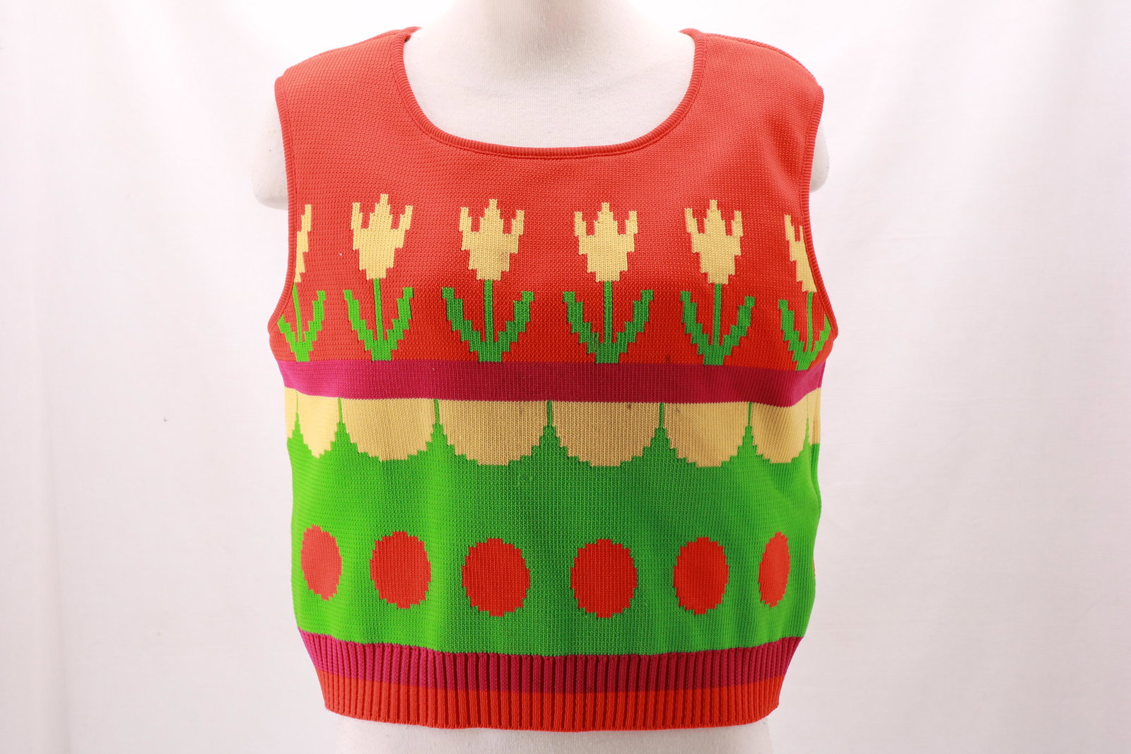 Vintage 1960's Polyester Tulip Vest: Vintage 1960's Polyester Tulip Vest. Very thick knit sweater vest with tulips and orange circles. Couple of spots on the front- please see photos. Approximate measurements: Bust 38", Length from cente