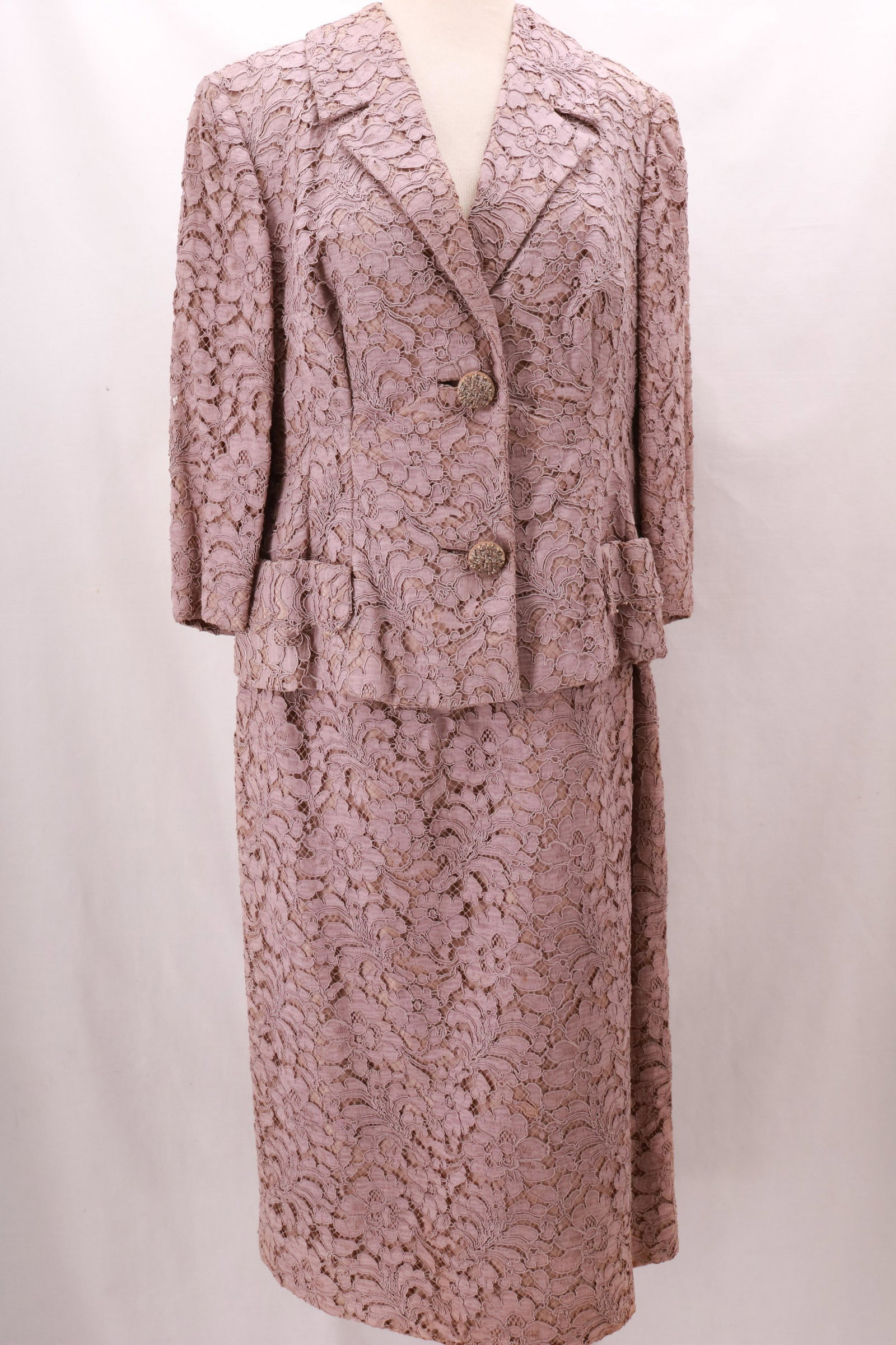 Vintage Lace Suit Dress: Vintage Lace Suit Dress with suede and bead covered buttons. This is a one piece dress that wears to look like a jacket and a skirt. The lace is substantial in weight. Inserted 15" metal zip opening a