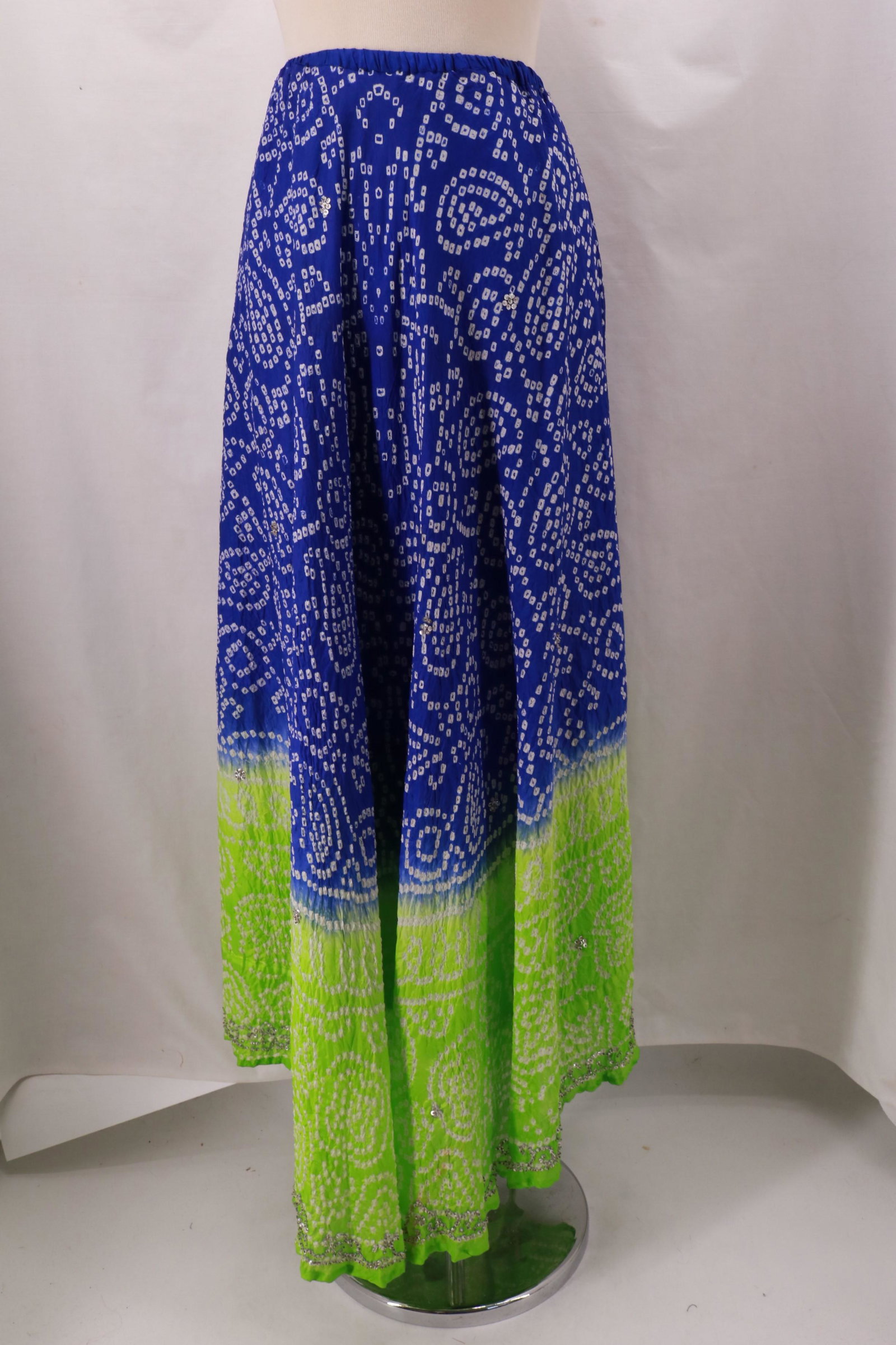 Vintage MAGIC Purple & Lime Green Ombre Tie Dye Skirt: Vintage Purple & Lime Green Ombre Tie Dye Skirt with random sequins accent throughout the skirt and in a design all along the hemline. Elastic waist pull on. Polyester crinkle with hand applied sequin