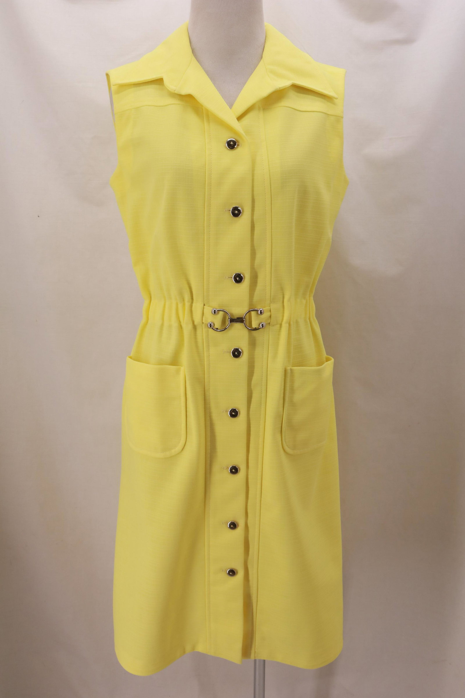 Vintage 1970's Lemon Yellow Dress: Vintage 1970's Lemon Yellow Dress with silver button full front open and silver equestrian buckle built in belt at the waist. 2 applied hip pockets. Approx. measurements: bust 38", waist 30" (unstretc