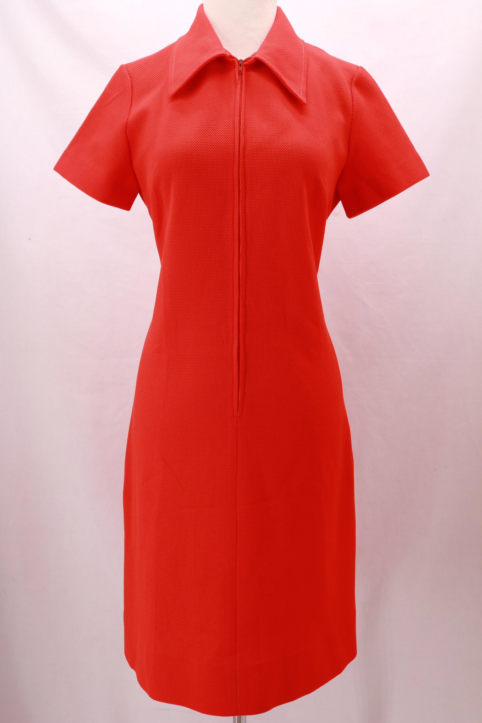 Vintage BLEEKER STREET Red Polyester Zip Front Dress: Vintage BLEEKER STREET Red Polyester Zip Front Dress with great texture and slightly oversized collar. Approximate measurements: bust 38" , waist 34" length from center shoulder seam to hem down the f