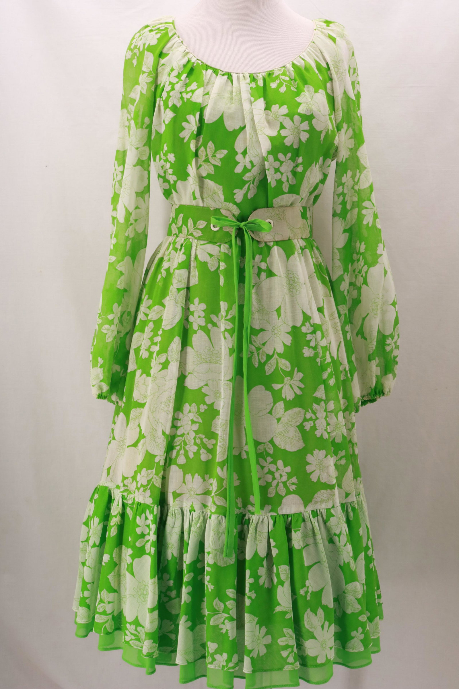 Vintage 1970's MISS ELLIETTE of California Green Floral: Vintage 1970's MISS ELLIETTE of California Green Floral Dress with matching fabric belt, scoop neckline and wide gathered hemline. This lightweight fabric is sheer and the main dress is fully lined. S