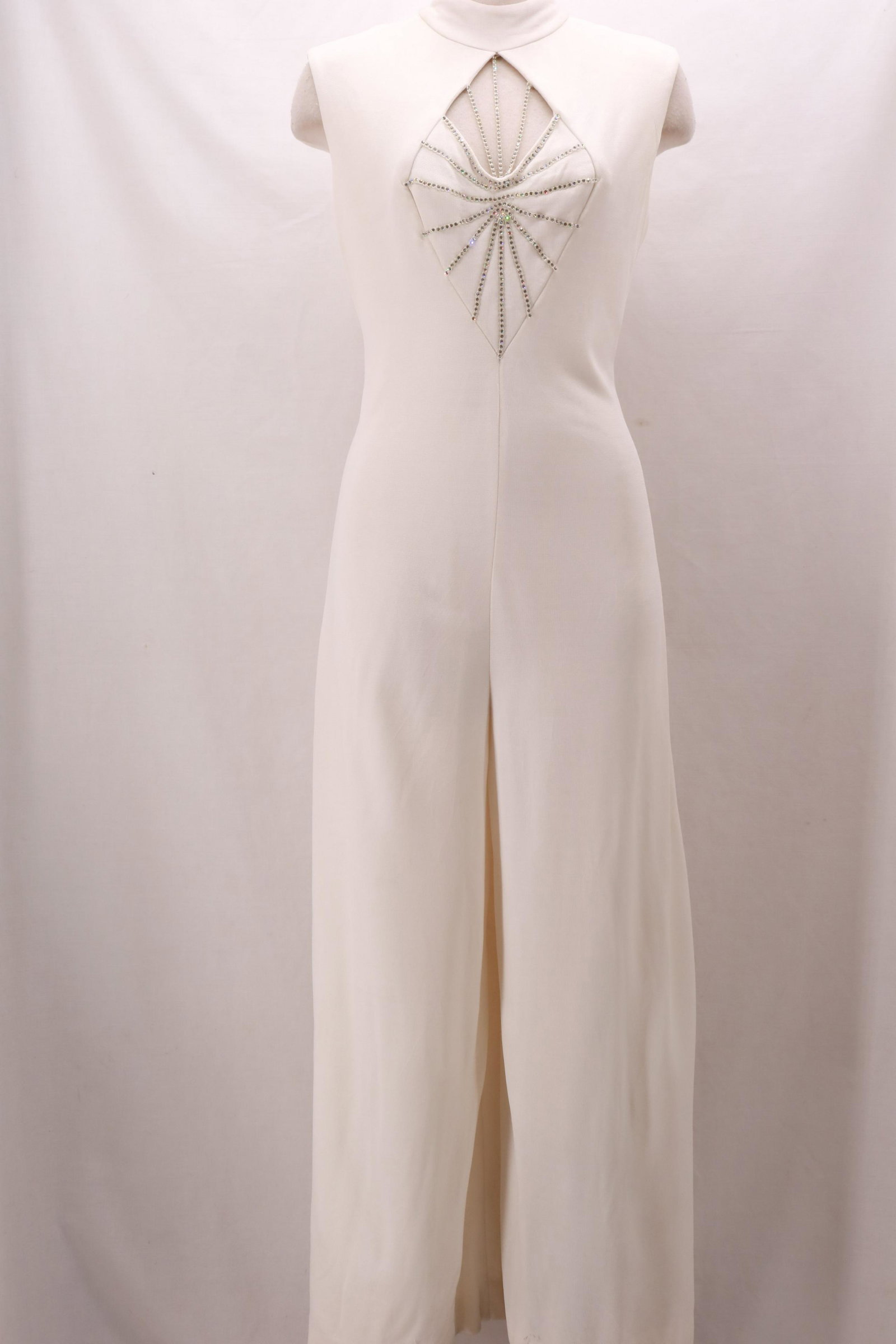 Vintage 1960's Sexy White Jump Suit with Rhinestone: Vintage 1960's Sexy White Jump Suit with Rhinestone Detailed Bodice. This nylon/poly piece is substantial in weight. The starburst rhinestone design at the front bodice with peek-a-boo bust is a real 