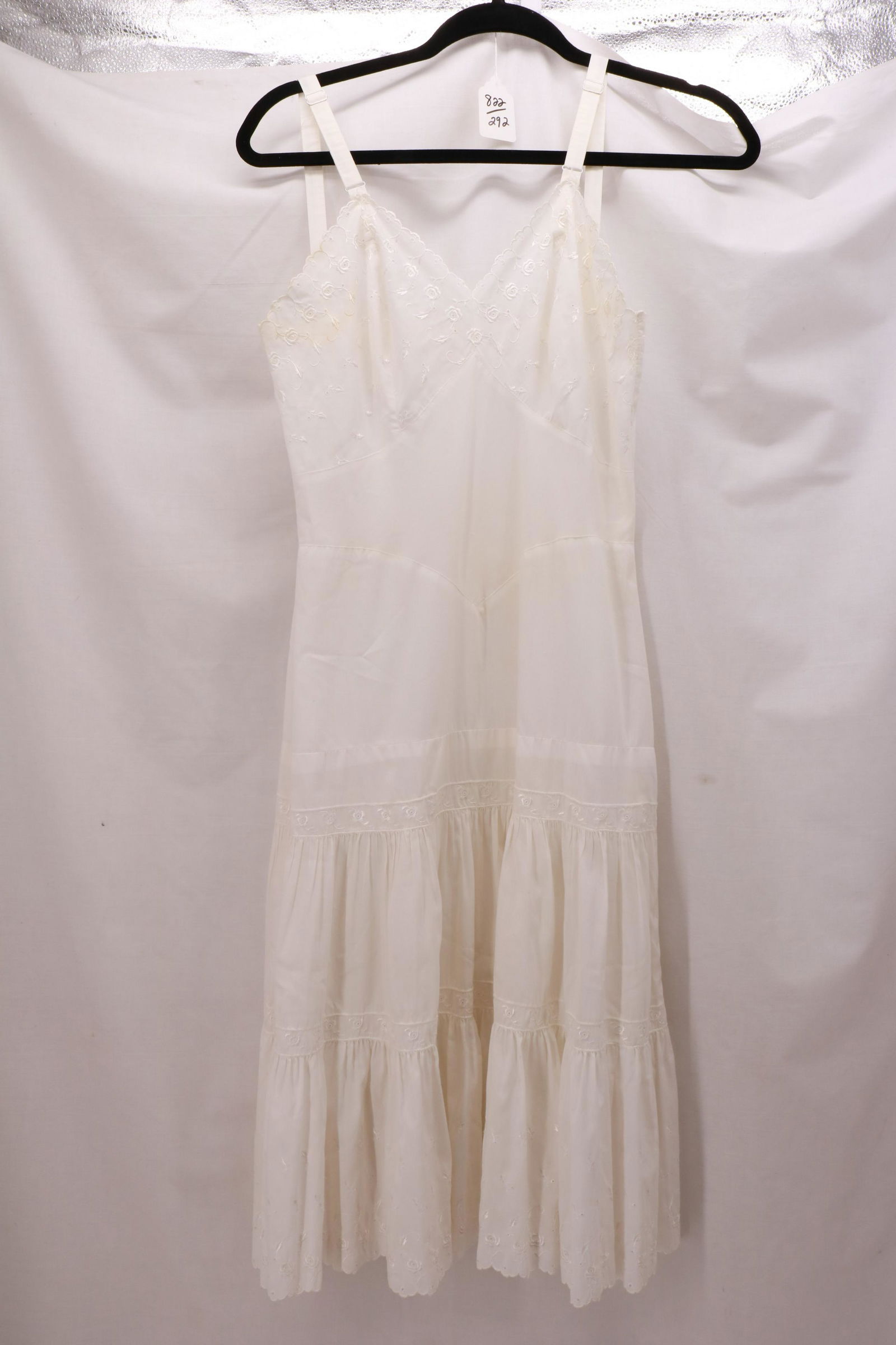 Vintage 1950's Cotton KOMAR LINGERIE Eyelet Slip: Vintage 1950's Cotton KOMAR LINGERIE Eyelet Slip with fitted waist and two tiered gathered skirt. The hem is scalloped eyelet. There is discoloration at the underarms. Approximate measurements: bust 3