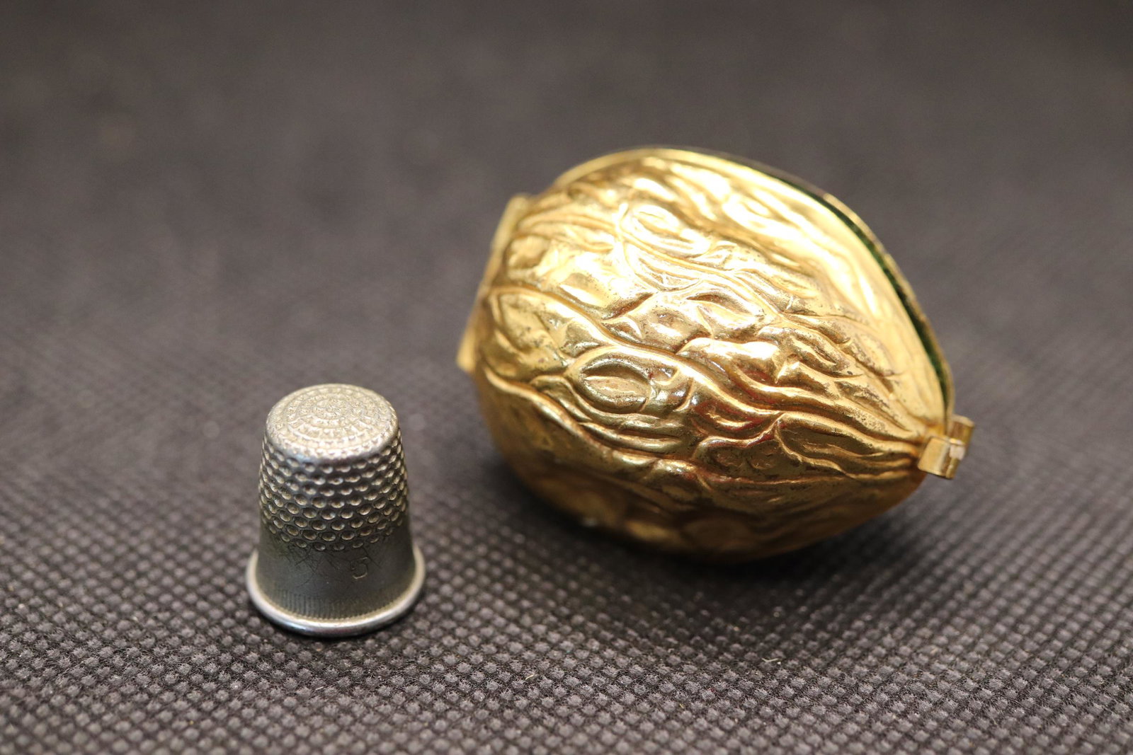 Vintage Gold Tone Gilt Metal Walnut Thimble Holder: green felt inside with tiny thimble