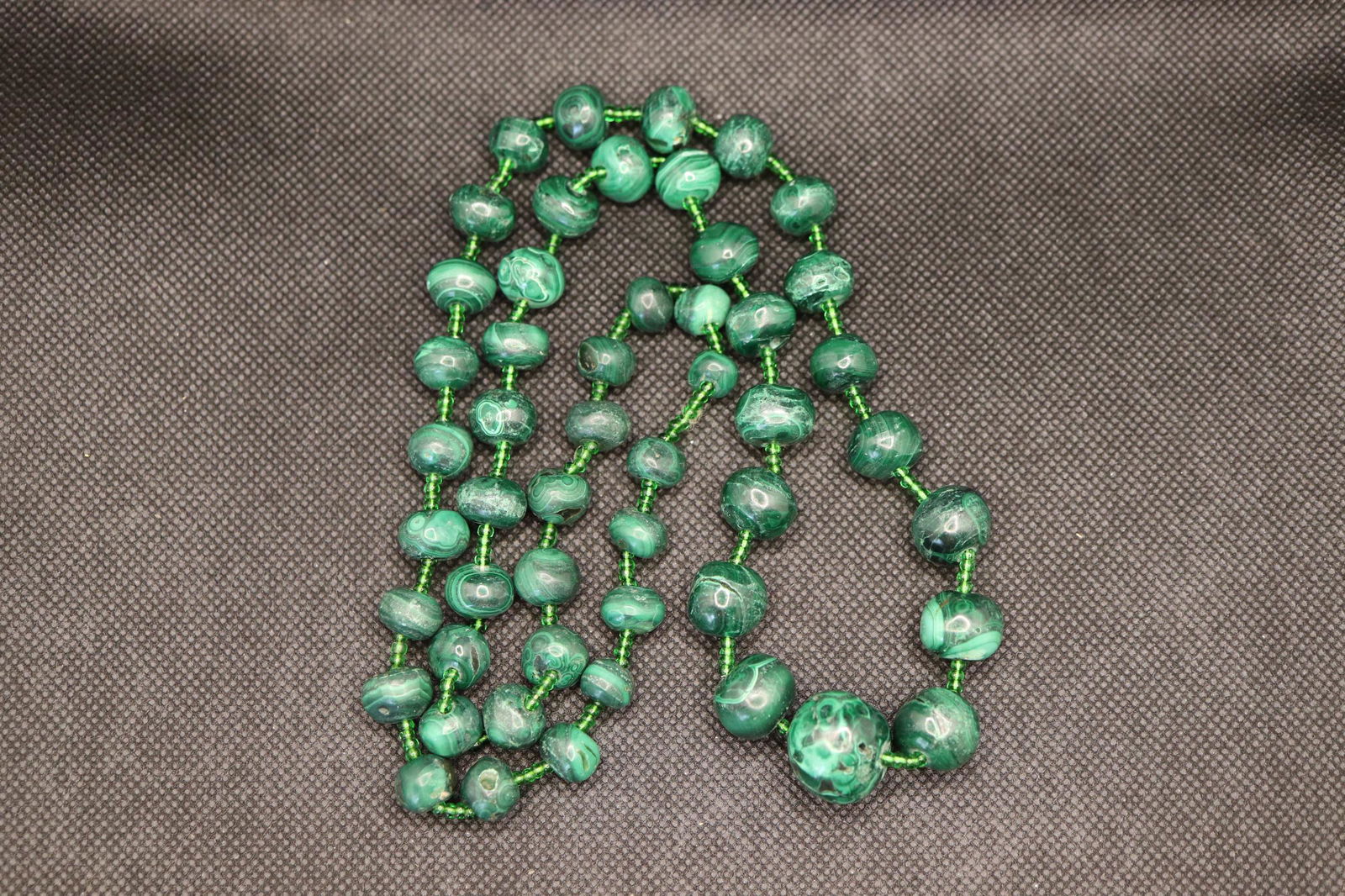 Vintage Genuine Green Malachite Graduated Beaded: graduated beads genuine green malachite beads with green glass beads inbetween. Approx. 30 inches