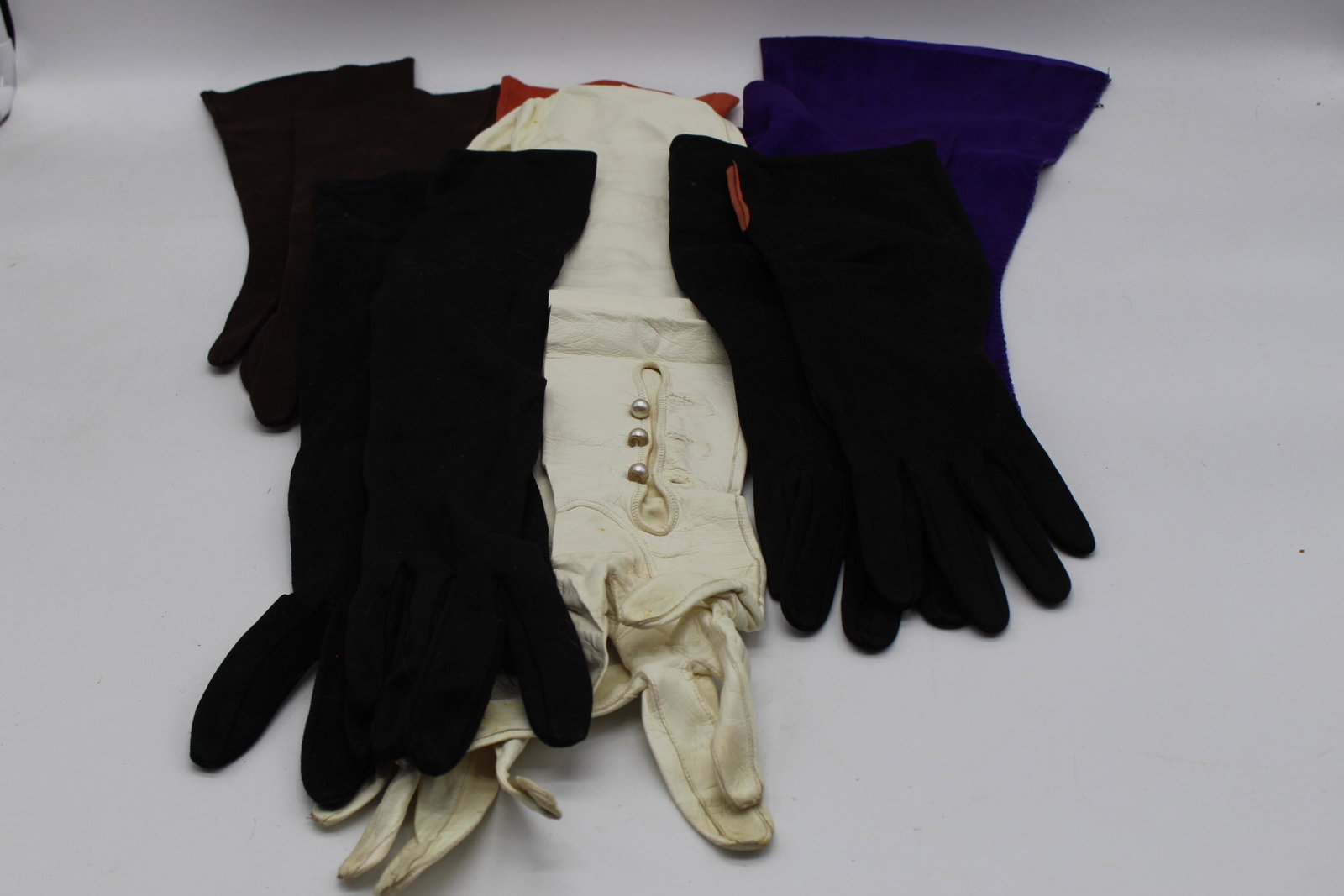 Lot of 6 Pair Vintage Elbow length Gloves: purple seude by John Frederics, white leather and other fabric