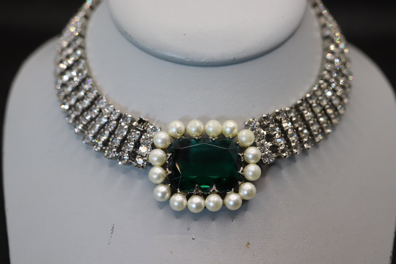 Vintage Rhinestone Chocker with Large Green Stone &: large green cut stone flanked with pearl beads and 4 rows of rhinestones that go around neck. 2 rhinestones are missing, beautiful piece, approx. 14 inches total length