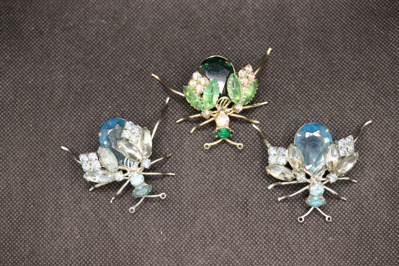 Set of 3 Vintage Jeweled Bug Clothing Decorations: made to be sewn on fabric, would be great on hat or clothing, approx. 2 inches each, 2 blue stones with silver tone setting, one in green with gold tone setting