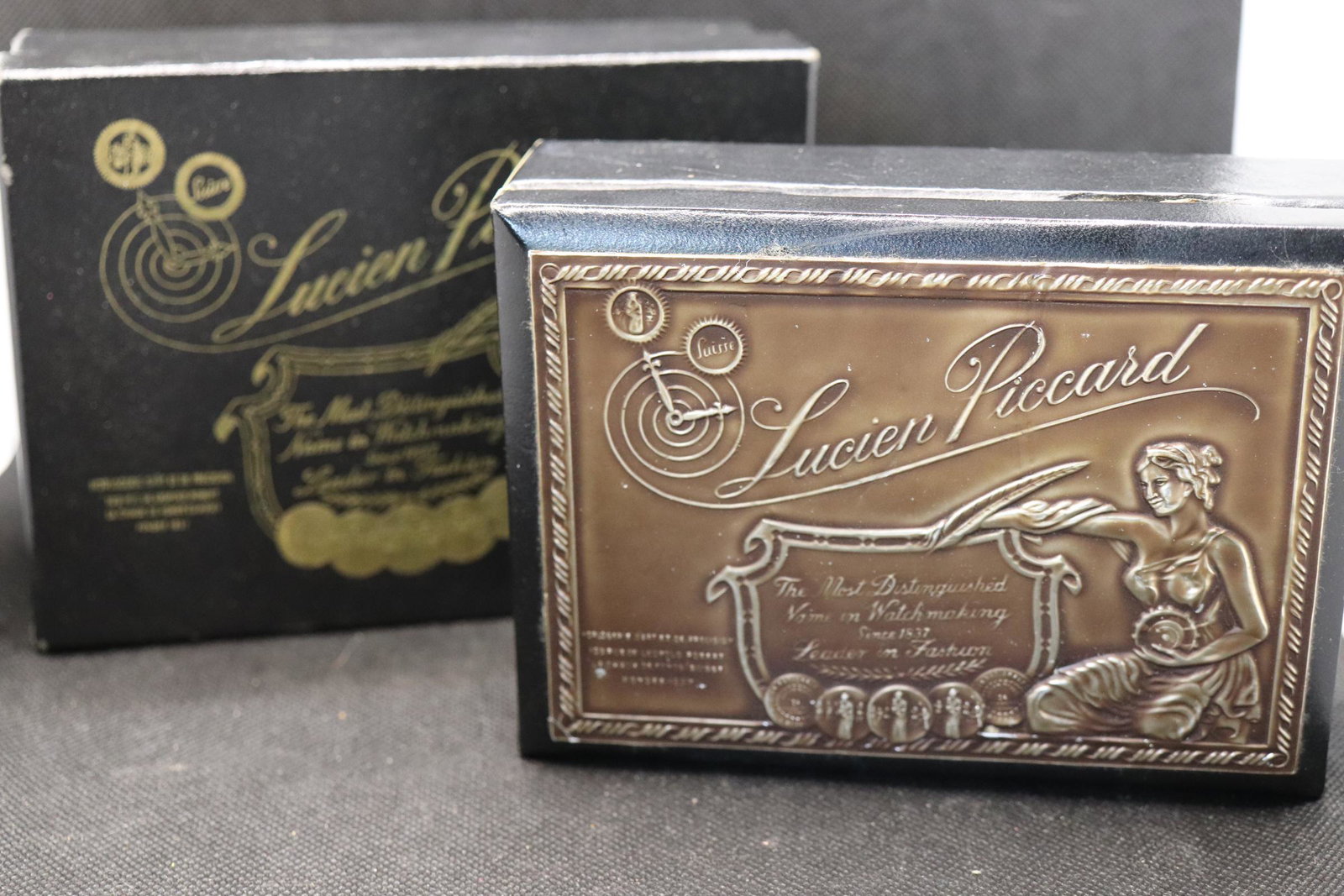 Vintage Lucier Piccard Watch Case with original Box: wood box jewelry box with embosed copper tone top and original cardboard box, case inside is green velvet