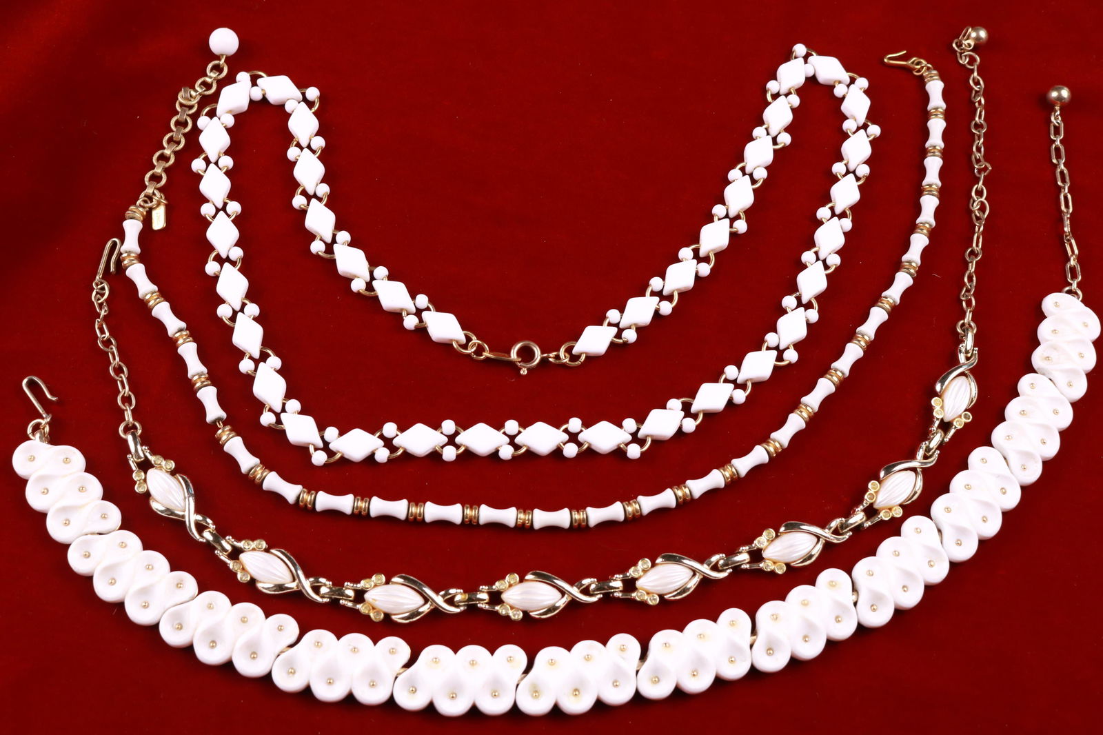 Vintage Lot of White Glass Necklaces- Trifari, Monet: Great lot of white glass bead necklaces. 2 pieces of vintage Trifari, one Monet and the fourth is not marked. All in excellent condition. Particularly interesting is the Monet bamboo necklace. The lon