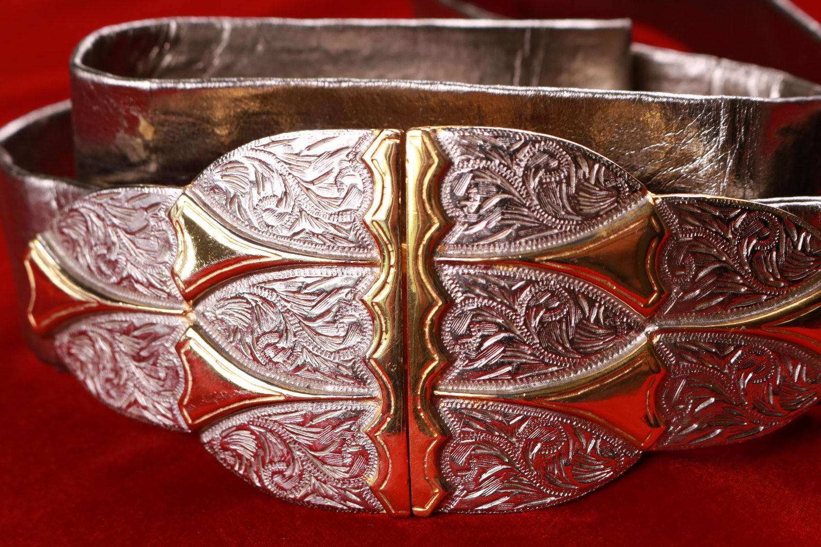 Vintage Accessocraft NYC Silver Leather Adjustable: Great vintage piece and adjusts at the back of each buckle. The gold/silver tone buckle is a real show stopper measuring 5" wide and 2.25" tall at the widest point.