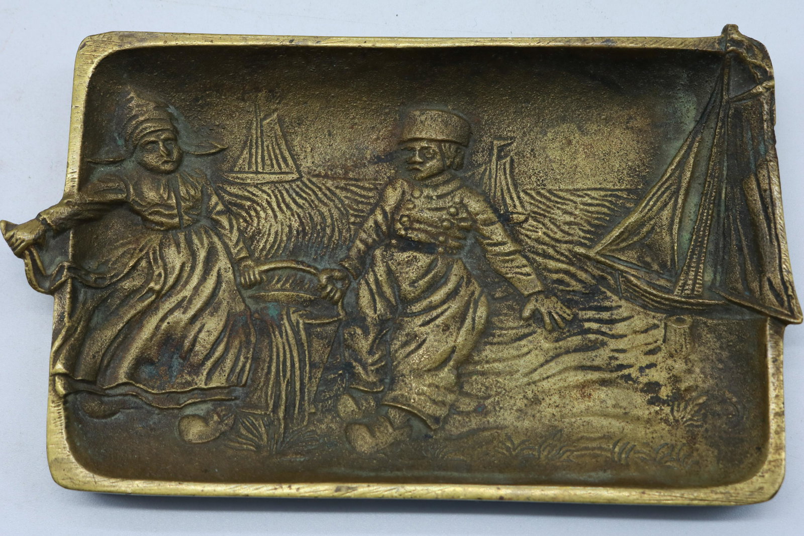 vintage 1945 Belgique Bronze Ashtray: Dutch boy and girl with sailboats, approx. 6 x 3 1/2 inches
