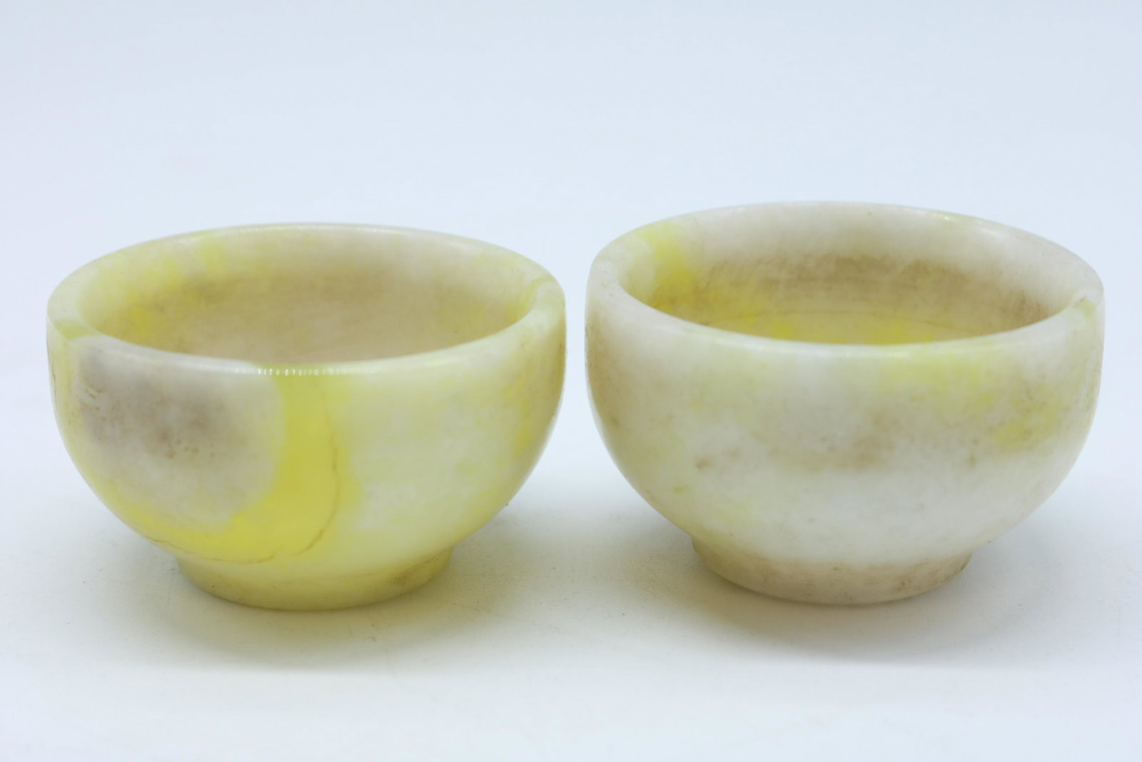 Pair Vintage Chinese Miniature Jade Bowls: green and white jade, approx. 1 1/4 tall x 2 inches wide