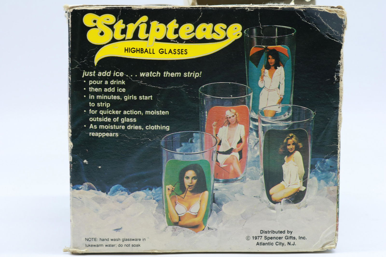 Vintage 1977 Striptease Glass Tumbler Set of 4: The add says, "just add ice and watch them strip". They look quite nude at room temperature as you can see from the photos. Glasses stand just over 5" tall. Excellent condition.