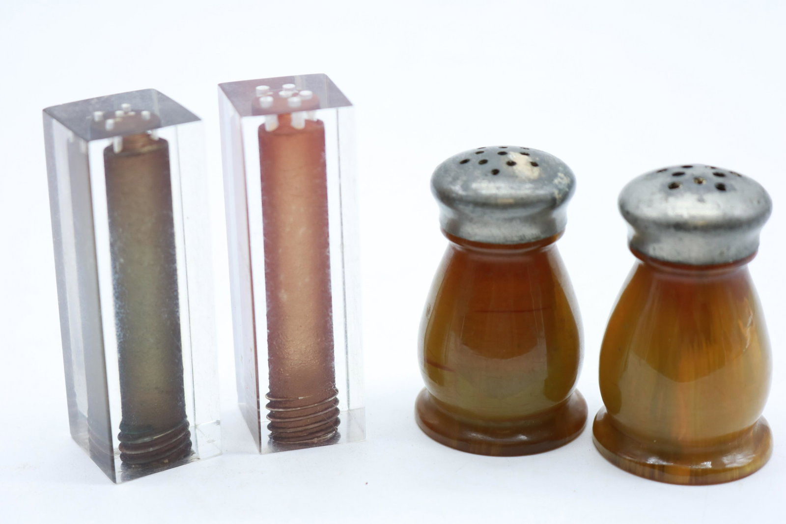 Vintage Bakelite and Lucite Salt and Pepper Shaker Lot: Great striations in the Bakelite set and the Lucite set one tube inside is green and one is amber. MCM fabulousness here.