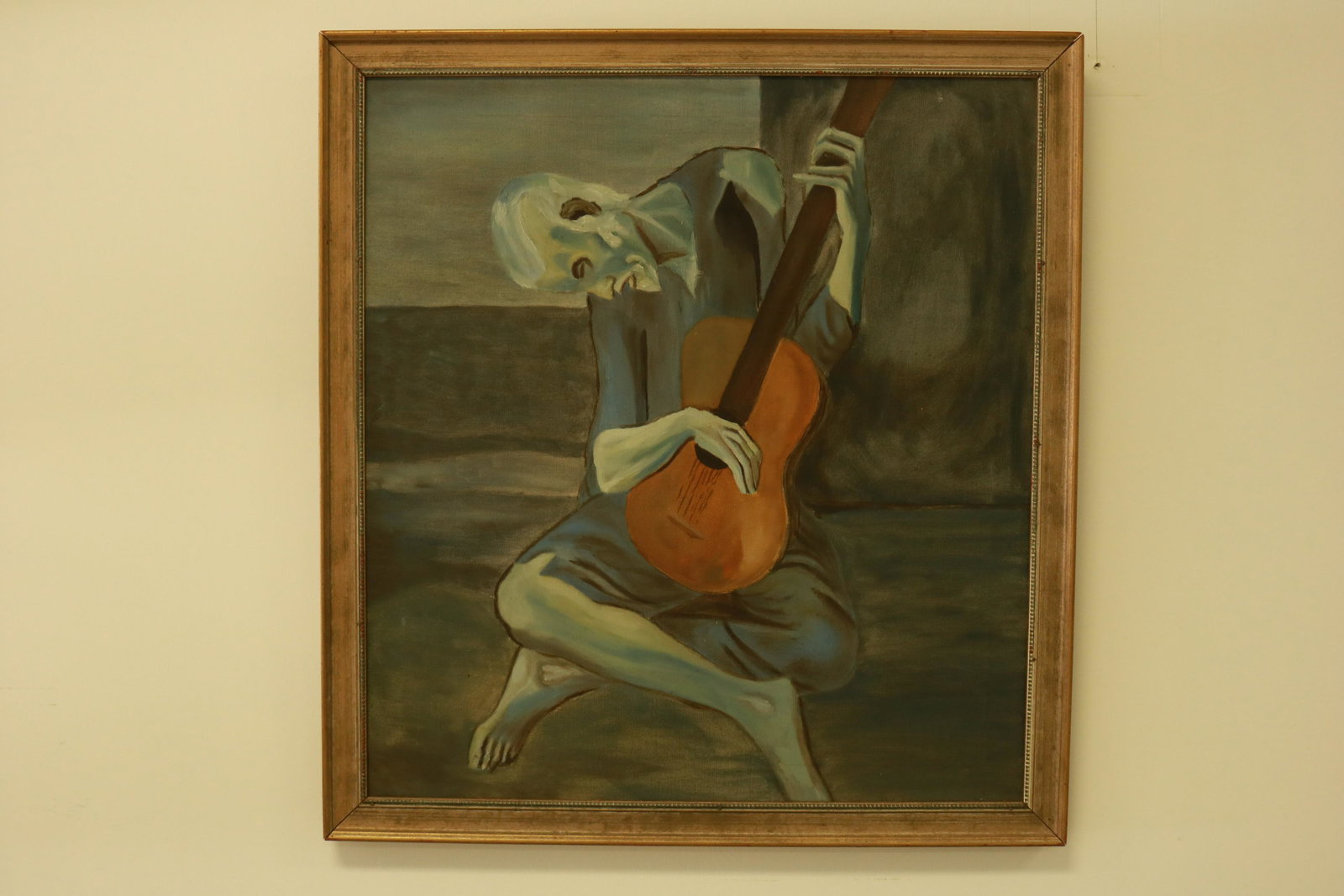 Vintage Pablo Picasso "The Old Guitarist" Reproduction: Wonderful executed reproduction of the famous Picasso original. Measures 26" x 28" overall. Image area measures 23.5" x 25.5".
