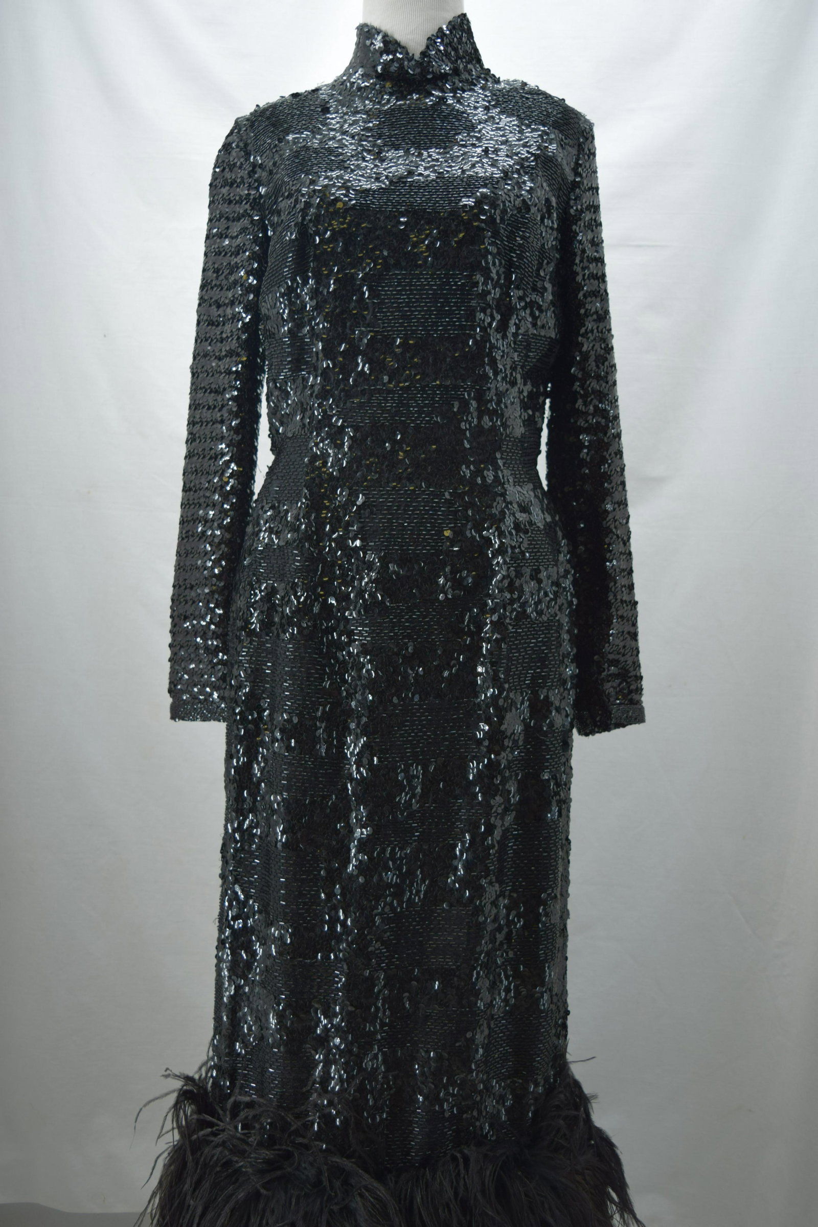 Vintage 1950/60's Sequin Full Length Shift with Ostrich: made in Hong Kong, fully black sequin and beading on rayon, long sleeves, high Madeiran collar, body con fit, satin lined, wide ban of ostrich feathers at bottom, metal zipped back, approx. 36 bust, 2