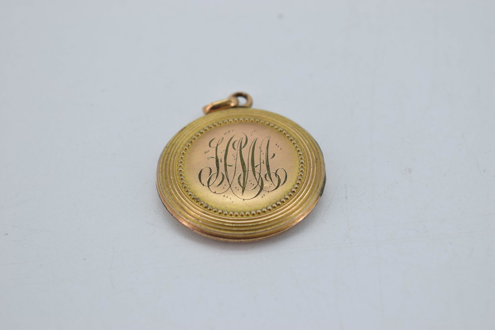 Victorian Monogrammed Locket Pendant, SBC co.: etched gold tone locket with monogram, marked inside SBC co. approx. 1 1/8 inches