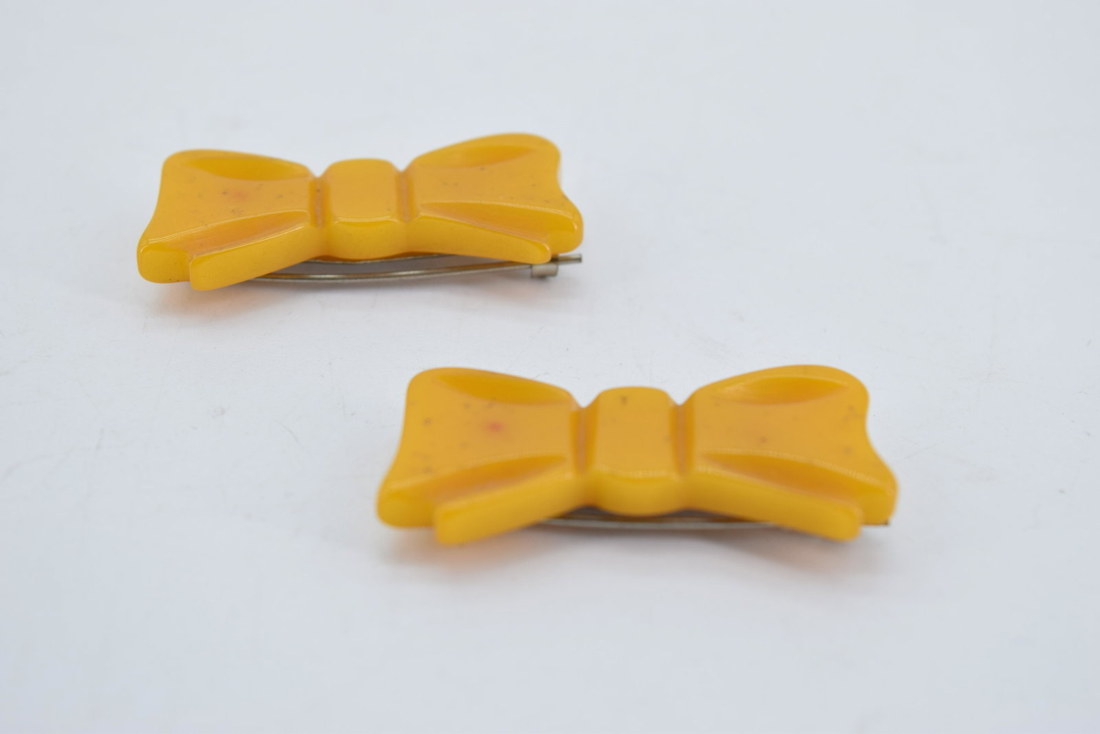 Pair of Vintage Butterscotch Bakelite Barrettes: bow barrettes, Bakelite, approx. 1 3/4 inches