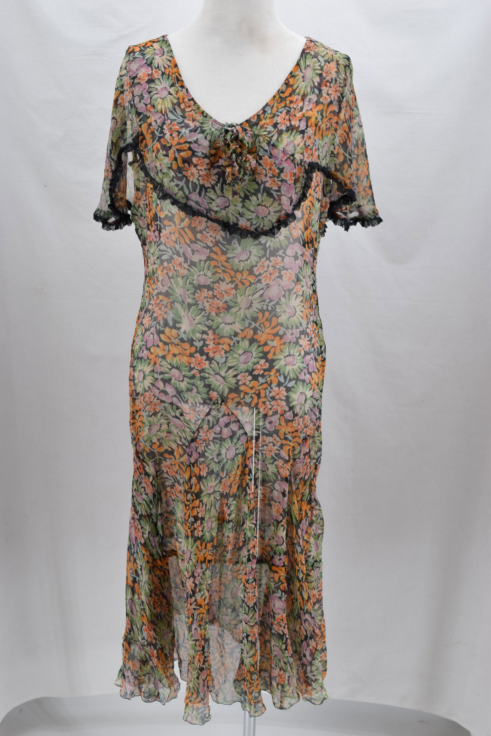 Vintage 1920's Floral Chiffon Dress: cape style color, sleeveless, fabric flower, drop waist, netted trim, unusual handkerchief style design bottom, approx. 38 bust, 32 waist, some scattered holes, old bad repair