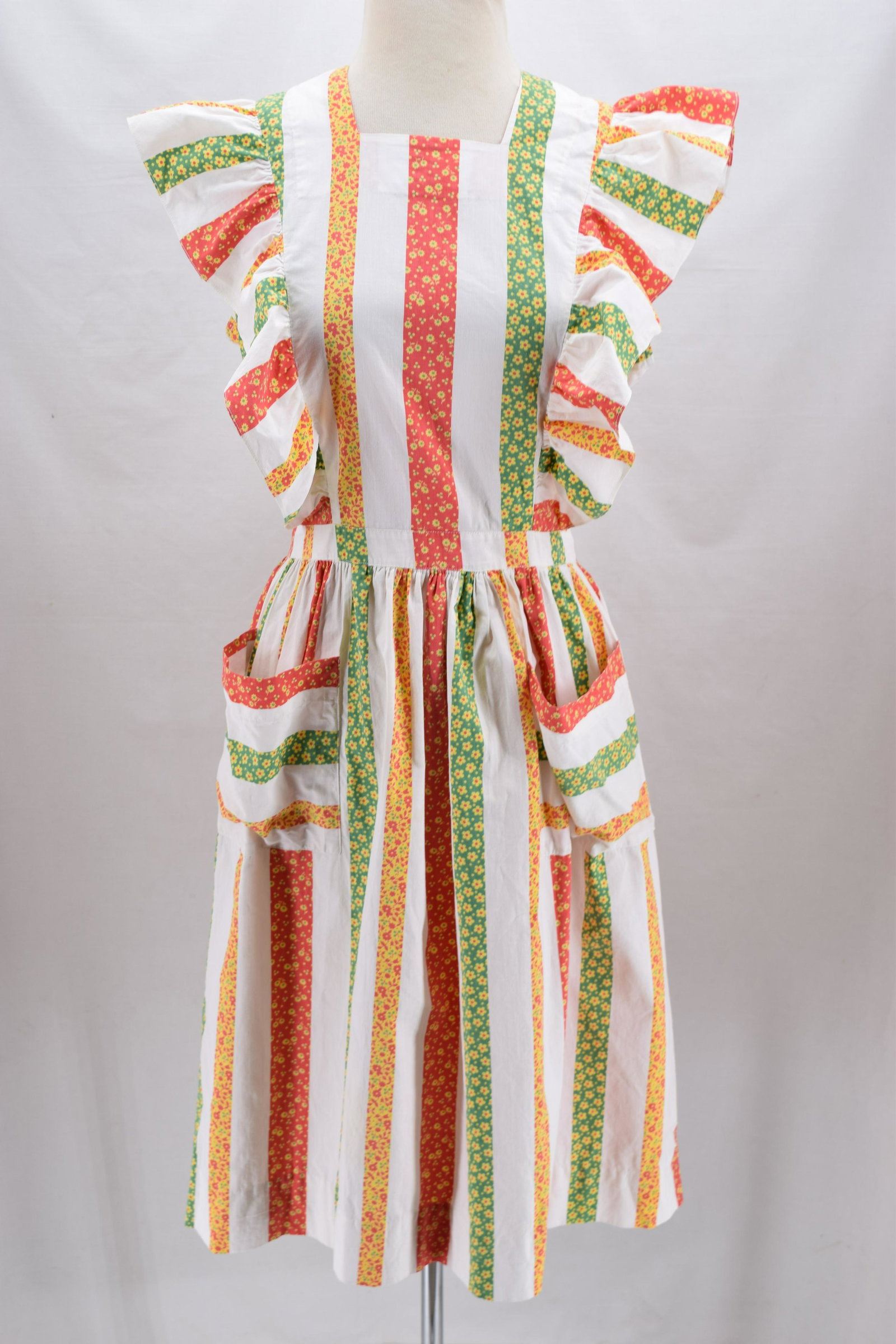 Vintage 1940's Cotton Pinafore Style Calico Print Dress: square neck, sleeveless with ruffle bodice, gathered at waist, large front applied pockets, buttons up back, great calico stripe print, approx. 38 bust, 30 waist, good condition, faint spot of discolo