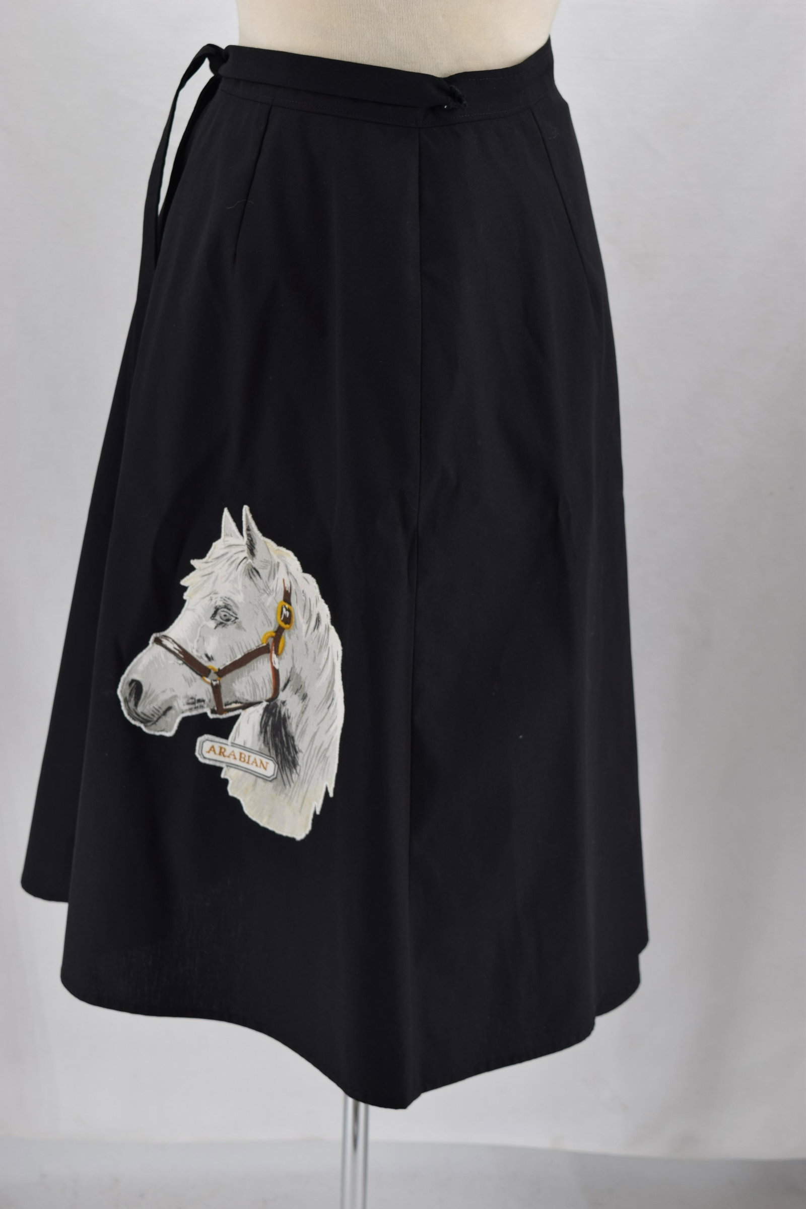 Vintage 1970's Wrap Skirt with Arabian Horse: black wrap skirt, with printed Arabian horse head, approx. 30 waist, 27 length, heavier cotton blend, good condition
