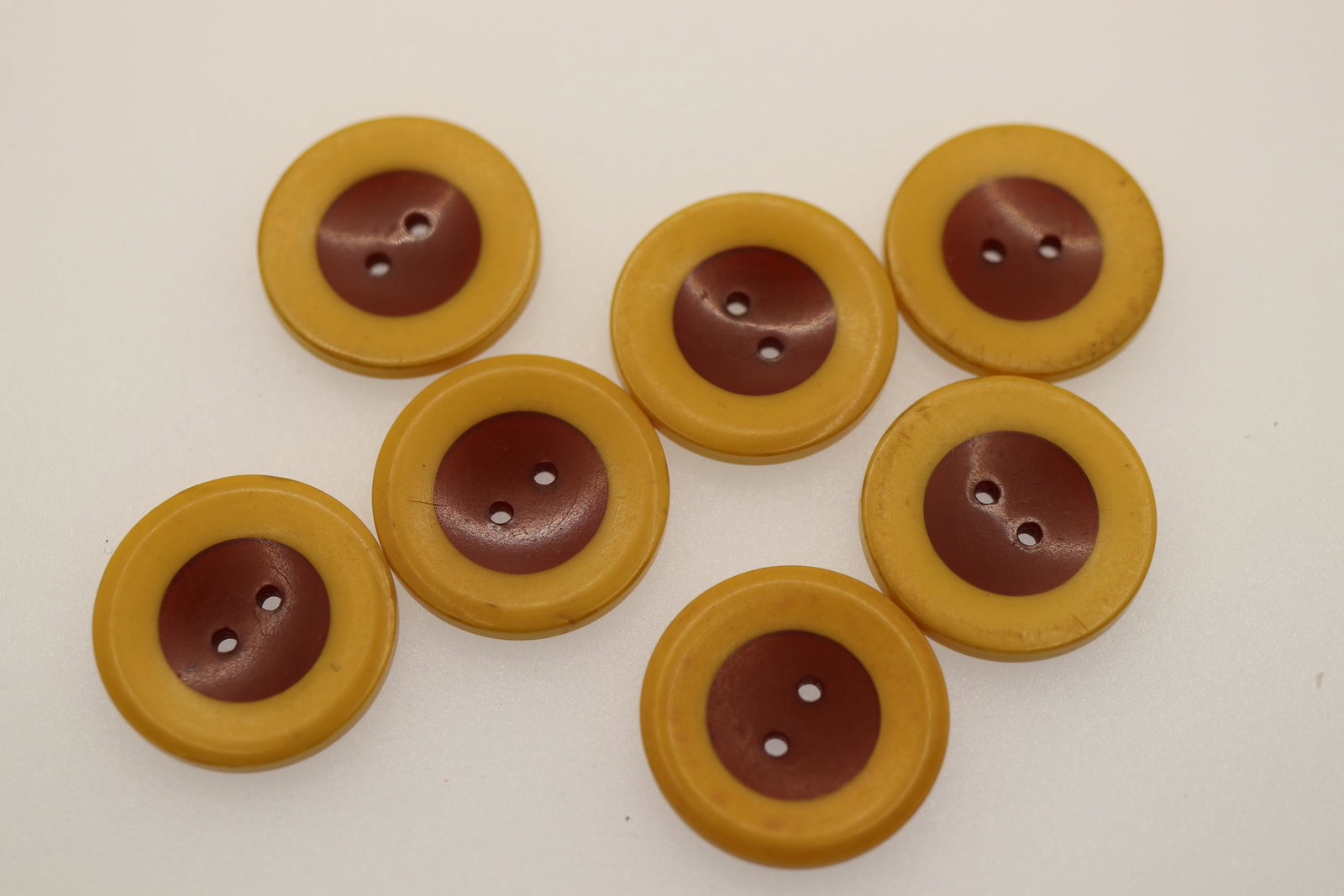Set of 7 Bakelite Cookie Buttons, 1940's: yellow and brown, 7/8 inch