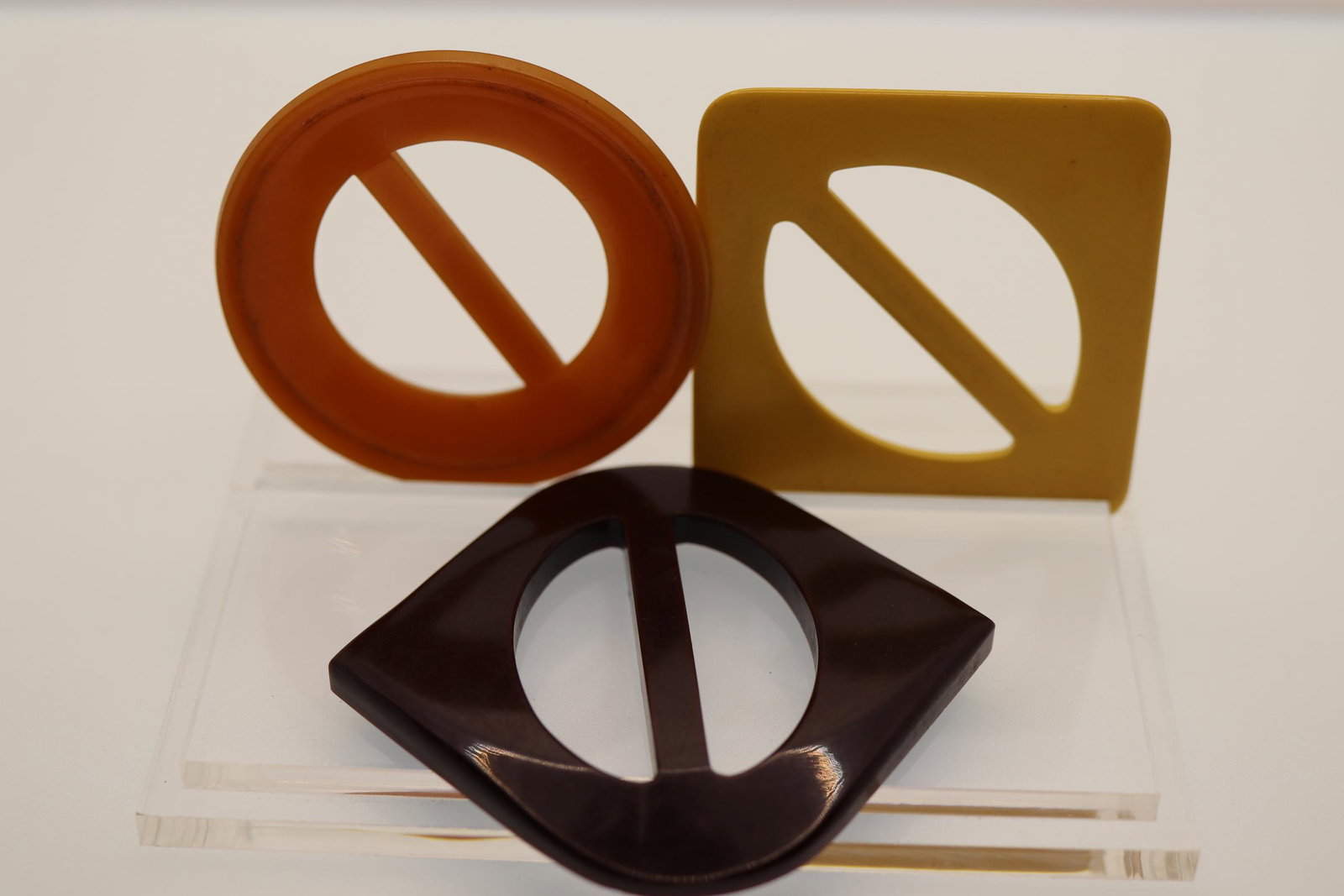 Lot of 3 Bakelite Buckles, 1940's: round butterscotch 2 1/2 inch, other 2 are 3 inches wide