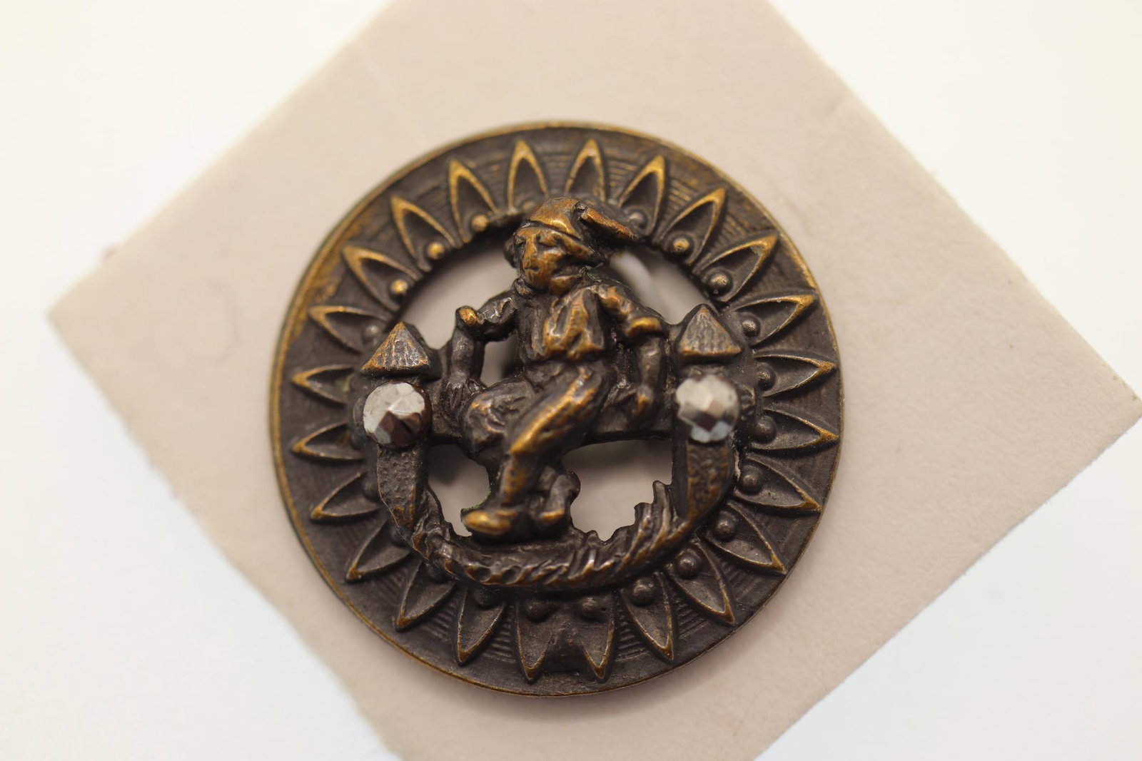Victorian Brass Picture Button, Boy on Fence: brass and steel cut with boy on fence, 3/4 inch wide