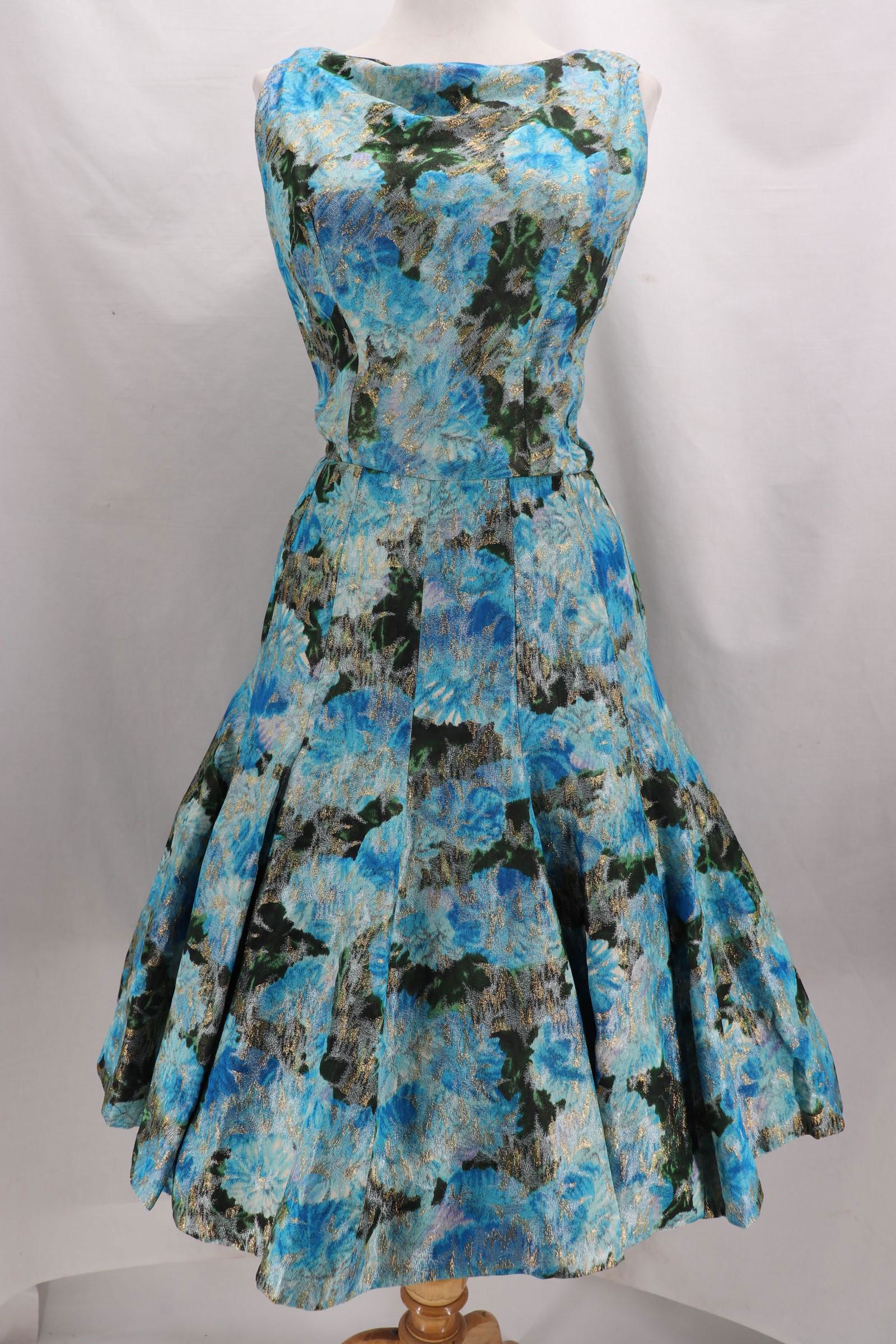 Vintage 1960's Suzy Perette, Floral Metallic Panel Dess: Sleeveless, Bateau Neck, Fitted Bodice, Panel Skirt with Great design, bust 36, waist 26, length of skirt 24, good condition