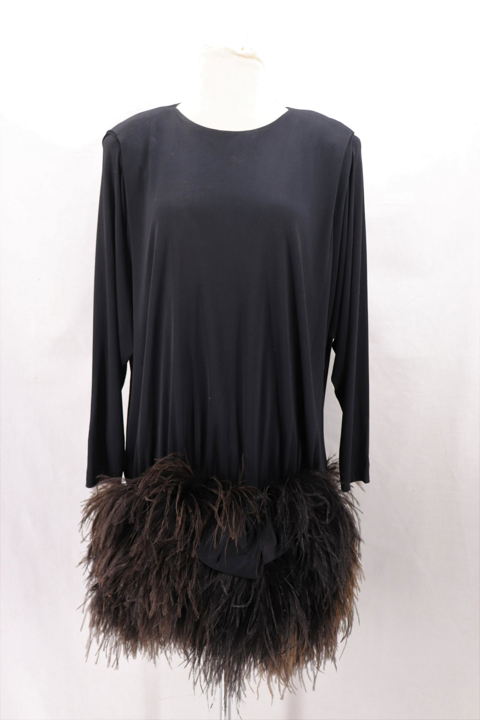 Vintage 1985 JEANETTE for ST. MARTIN Feather Cocktail: long sleeve black silk jersey dress with wide ostrich feather hem and satin bow, back zipper, bust 44, waist 38, some fade and hole found