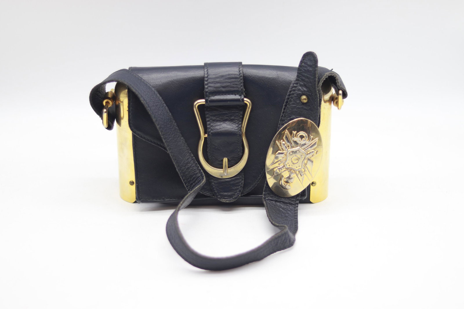 Vintage 1960's Leather & Brass Shoulder Bag: buckle front, brass sides, large buckle on strap with raise design of warrior and shield, 2 compartments, nice condition