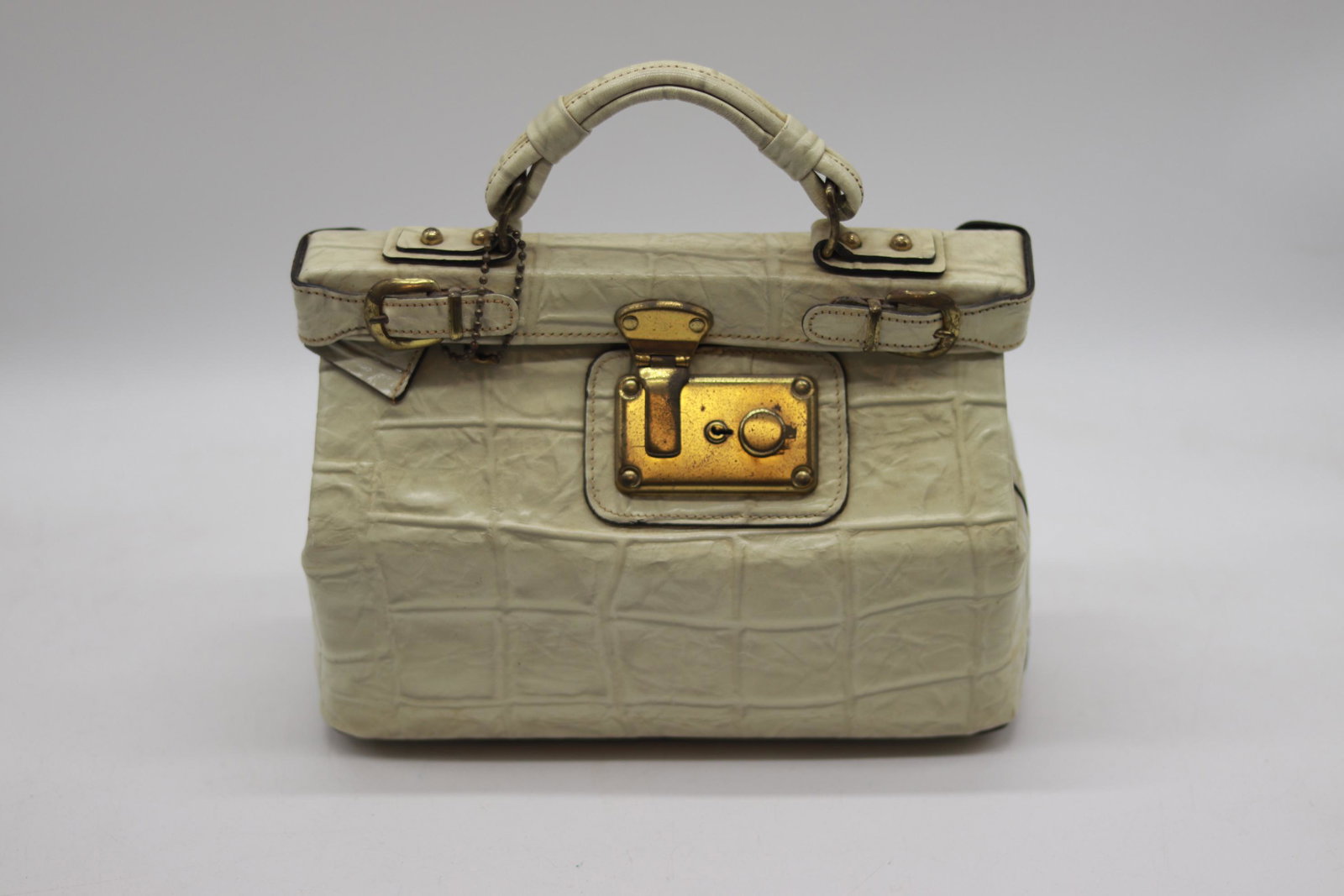 Vintage White Block Print Leather Purse: center top hand handle, belt buckles and Luggage style locking clasp, black interior, leather could use a cleaning