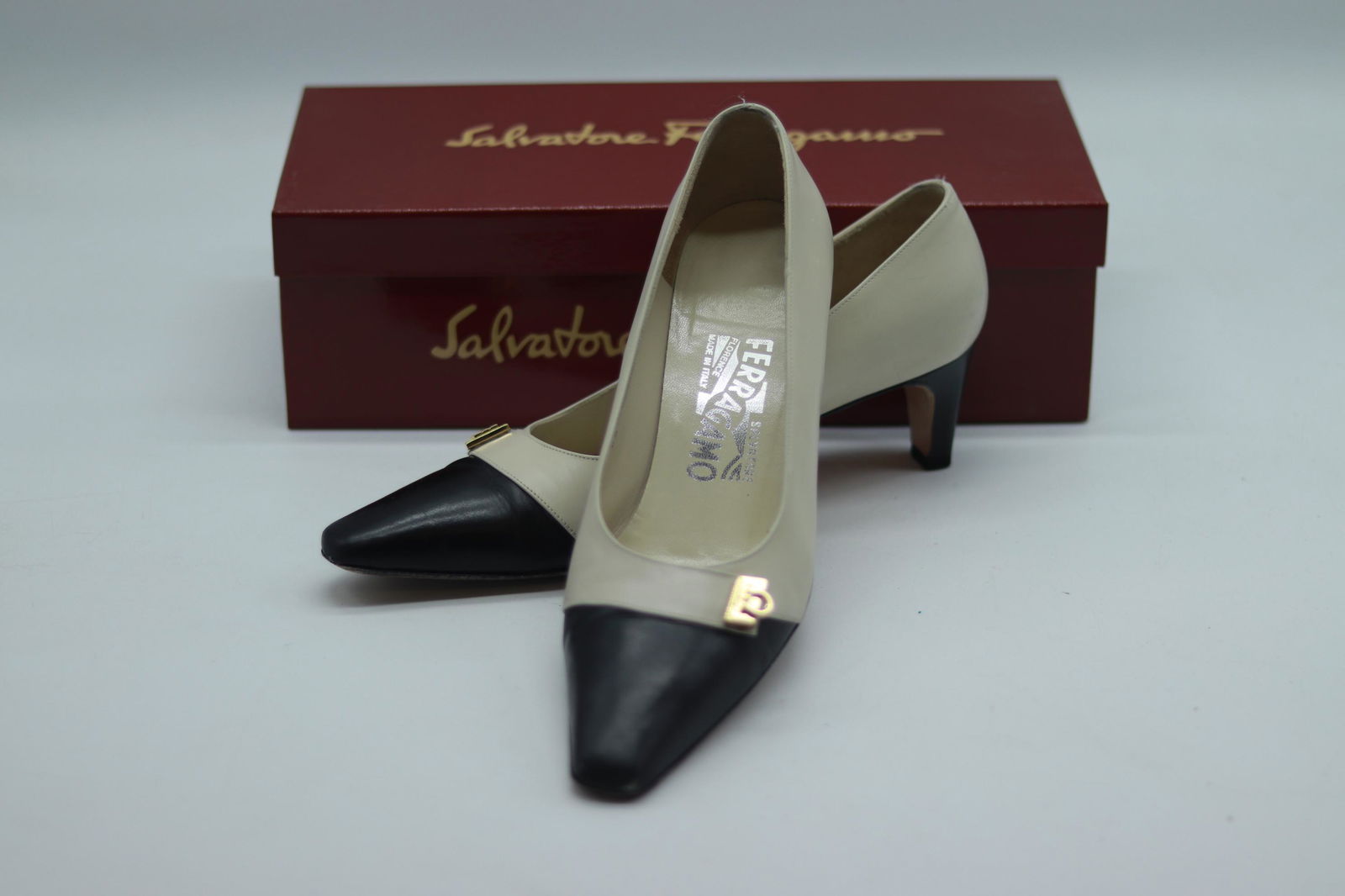 Vintage Salvatore Ferragamo Black & White Leather Pumps: size 7 1/2 Black and white leather, gold tone buckle, good used condition with box