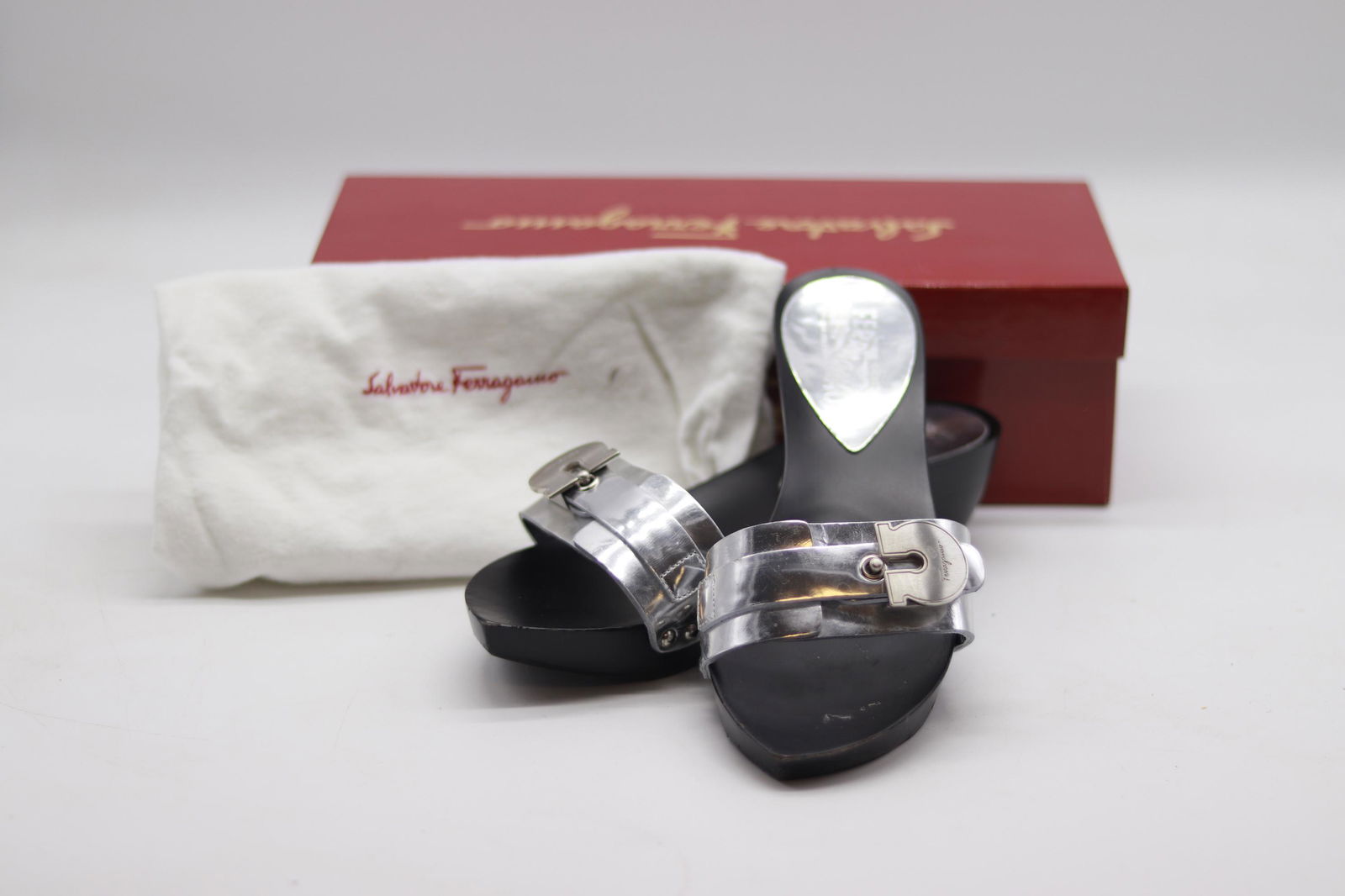 Vintage Salvatore Ferragamo Black & Silver Metal: heavy sandals with black base and silver metal with buckles, size 7, like new condition