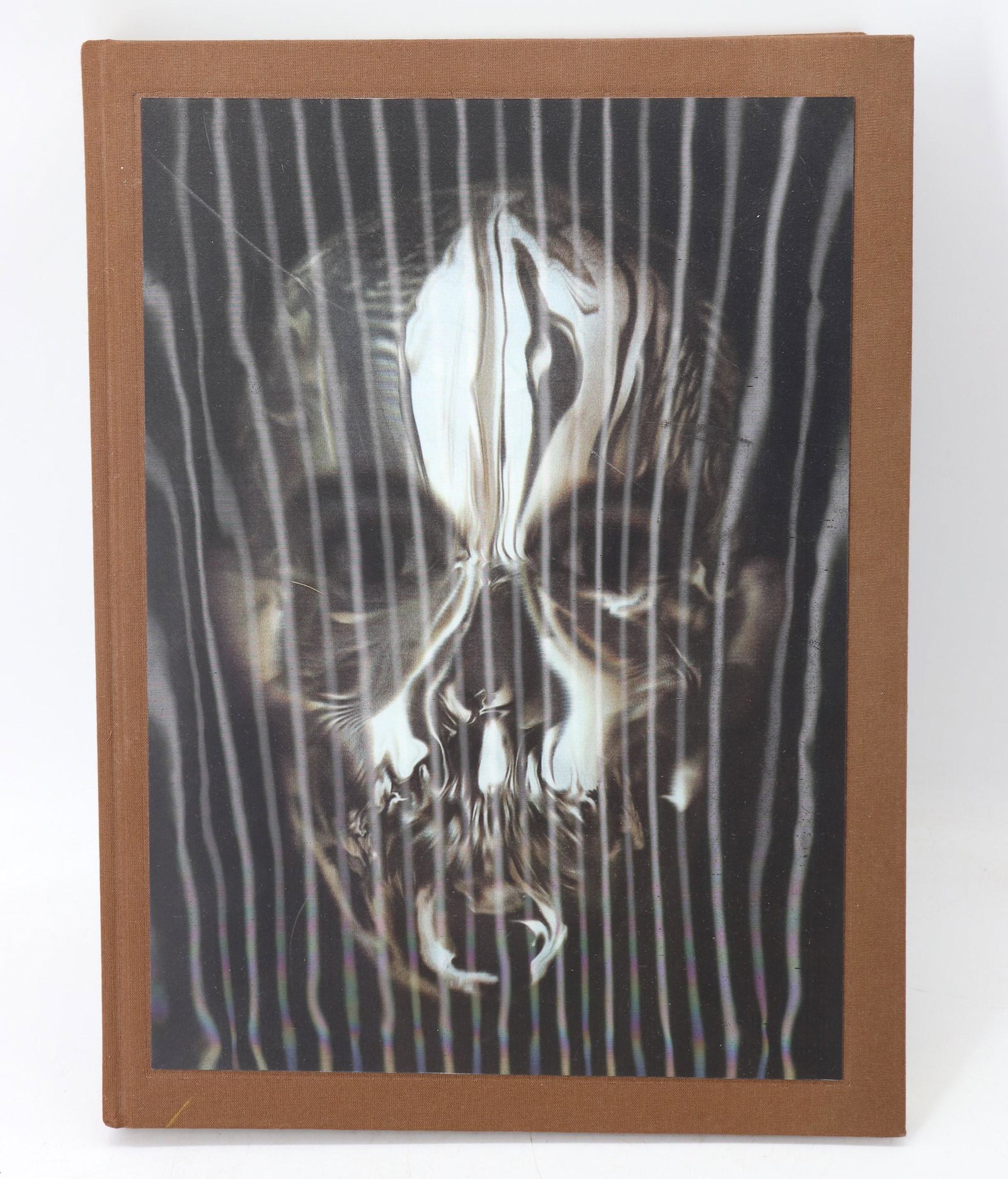 ALEXANDER McQUEEN Book, Savage Beauty: copyright 2011, Hologram image of skull on cover does have a scratch, book in great condition otherwise