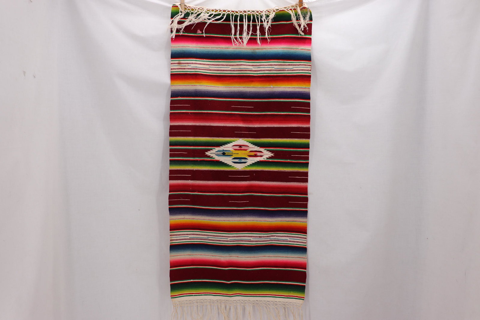 Vintage Hand Woven Mexican Wool Runner: approx. 37 x 17 1/2, hand woven striped with center decoration, has small hole, stain and something stuck to it
