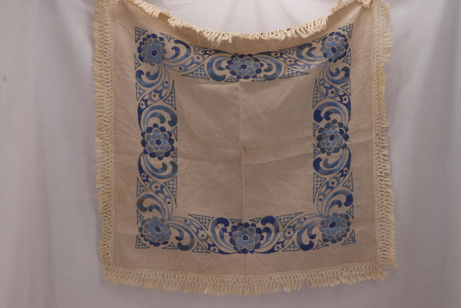 Vintage Arts & Crafts Era Table Square/Cloth: arts and crafts era hand embroidered with blue thread, on ecru cloth with fringe, approx.32 square