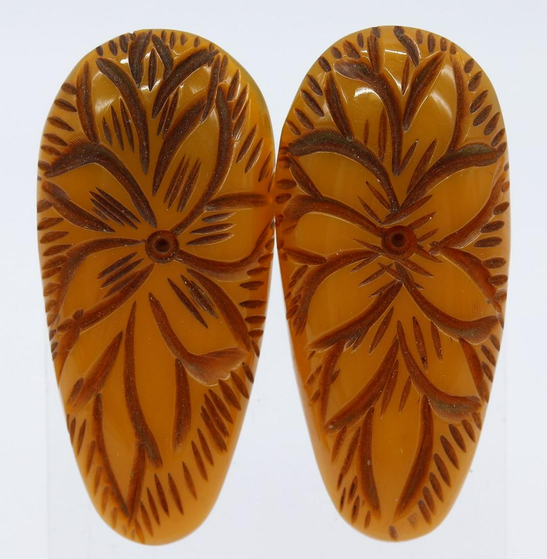 Pair of Vintage Bakelite Carved Shoe Clips: carved butterscotch Bakelite shoes clips, approx. 2 inches