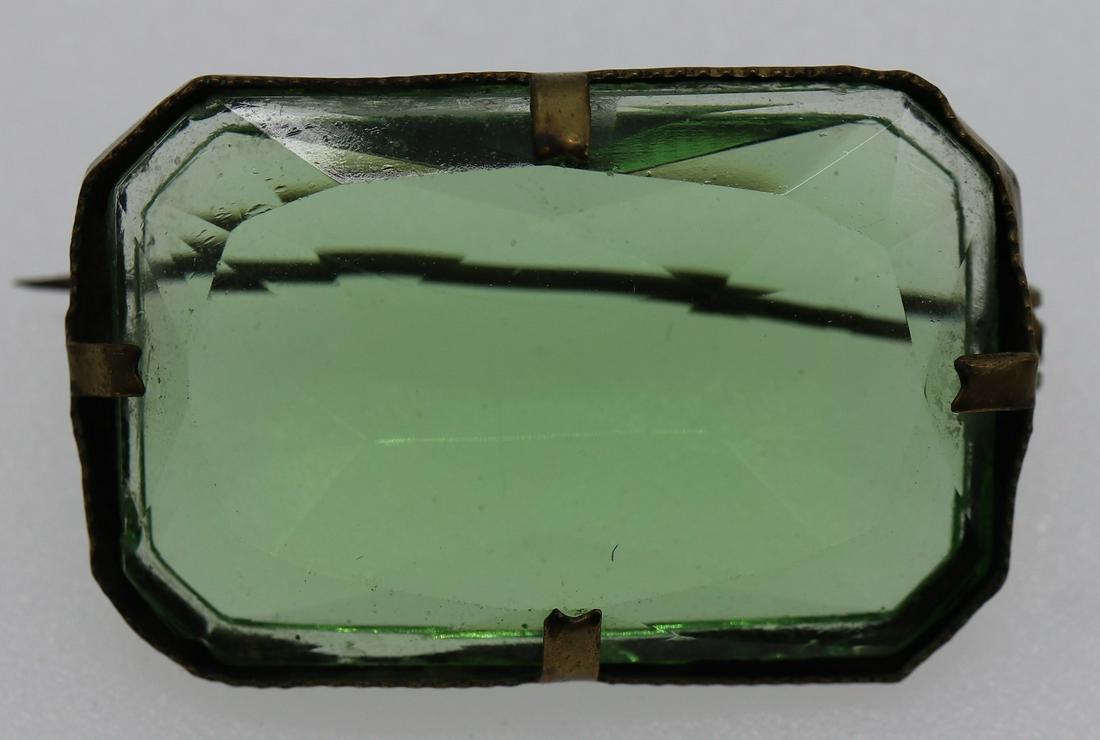 Antique Czechoslovakian Brooch: large light green stone in gold tone setting, marked Czech
