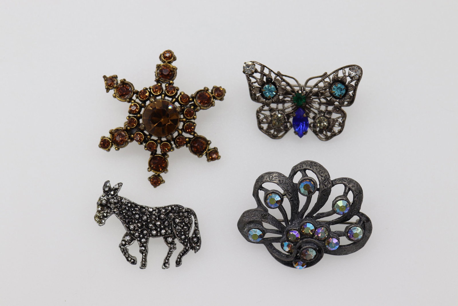Lot of 4 Vintage Brooches: unmarked butterfly with colored stones, marcasite donkey and two other