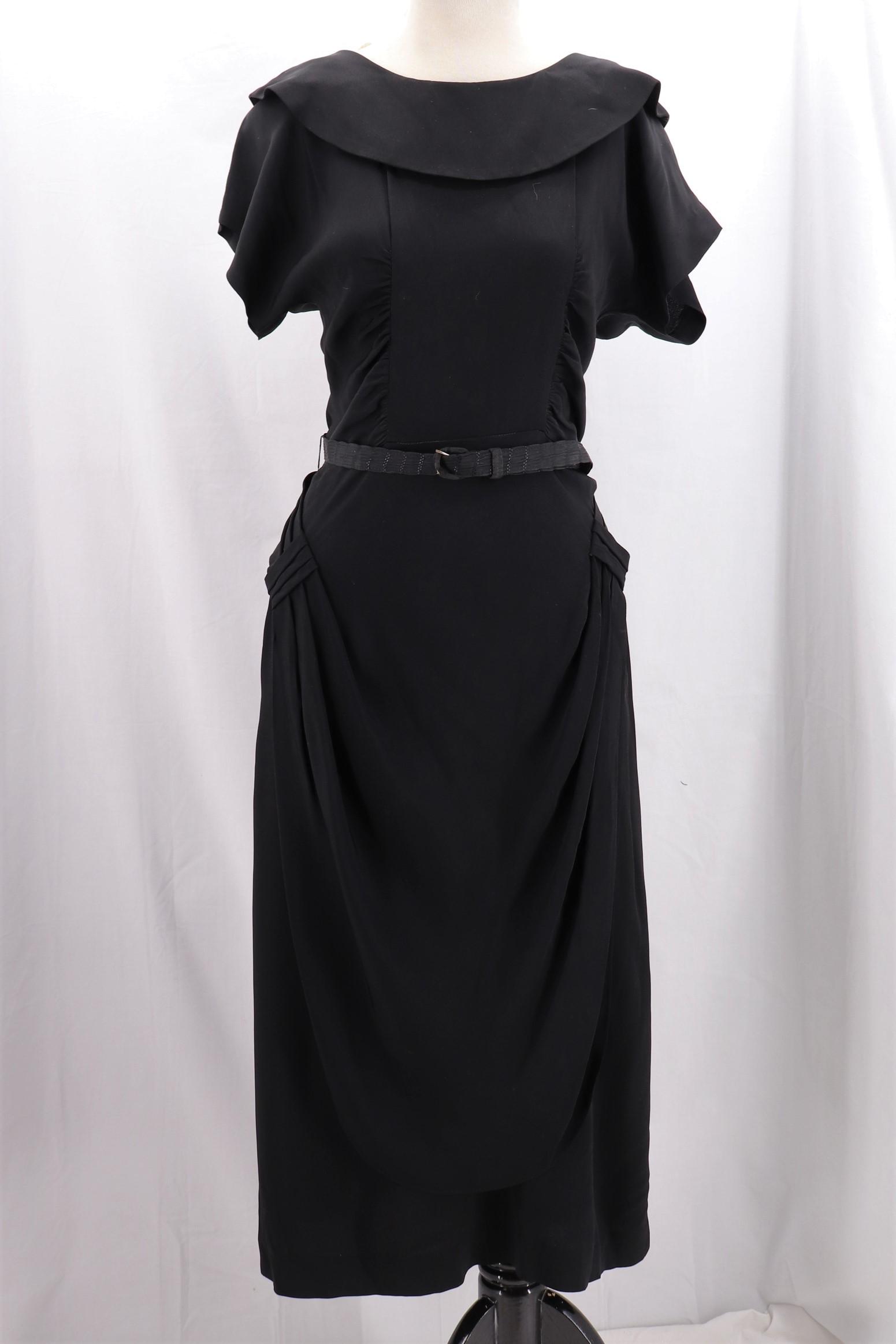 Vintage 1940's Black Rayon Dorothy-O-Hara Style: scoop neck, cap sleeves, ruched sides with crisscross at hips, back metal zipper, approx. 36 bust, 25 waist, 40 hips, good condition