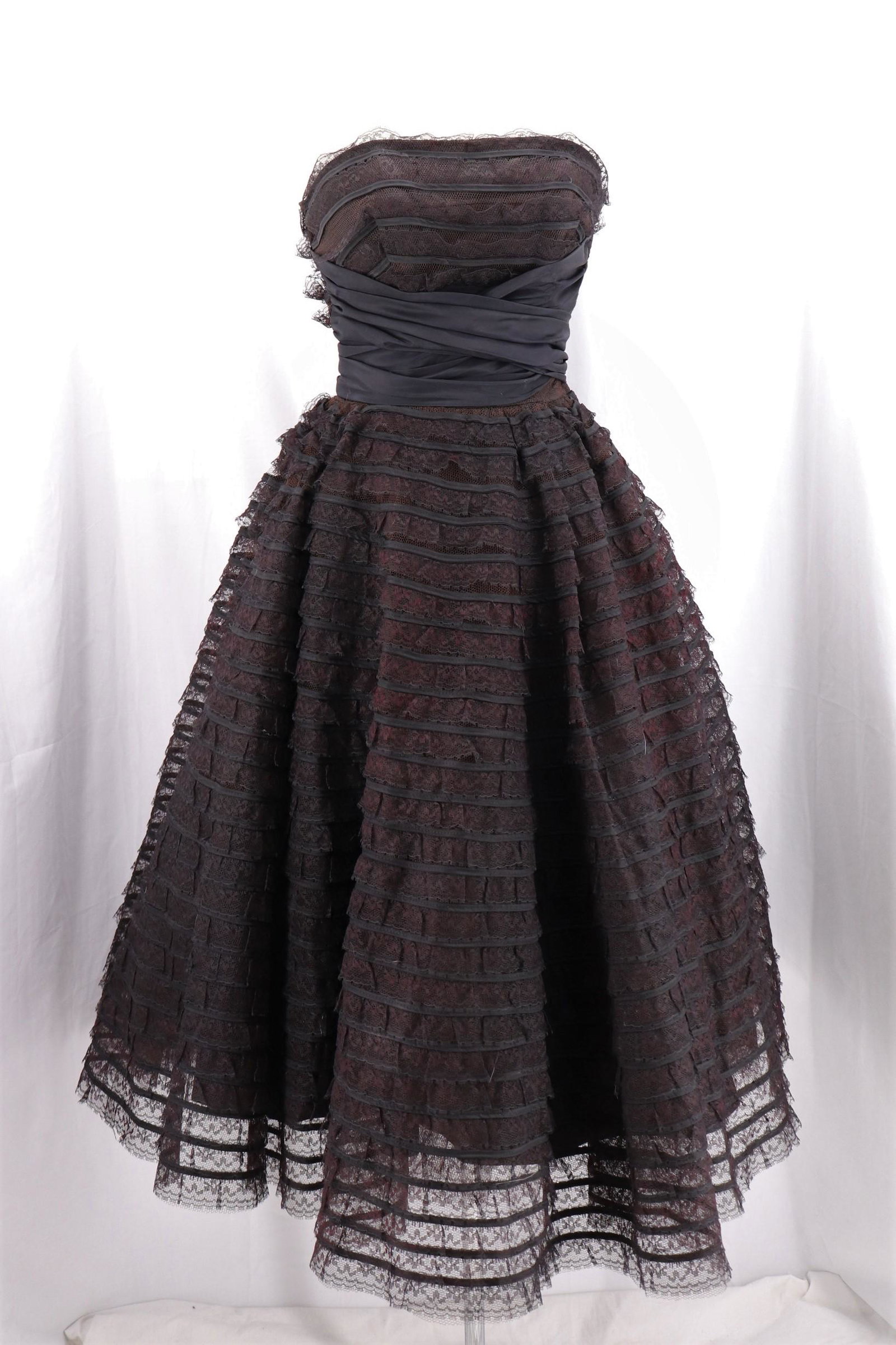Vintage 1950's Black Lace Cupcake Princess Dress: Old Store stock with tags, strapless, lace and satin ribbon with stain cummerbund that ties in back, side metal zipper, lined in satin, approx. 33 Bust, 26 waist, good condition