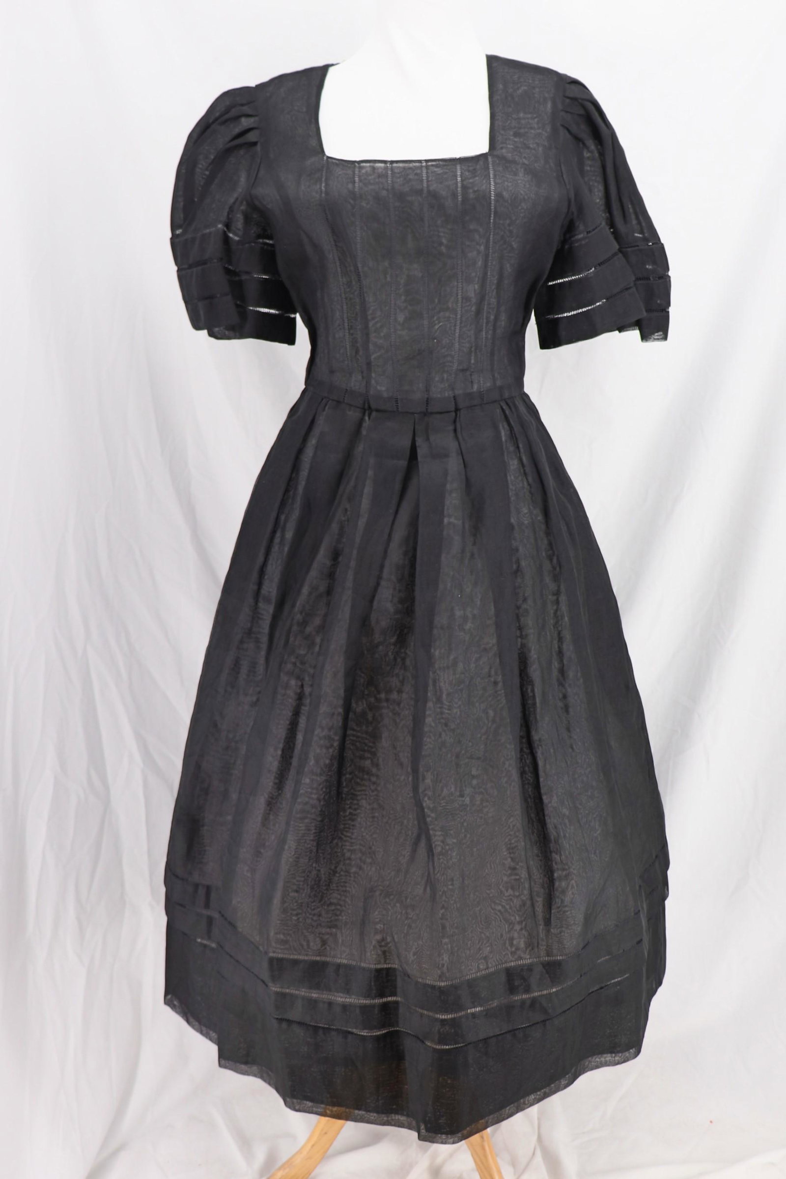 Vintage 1970's ALBERT NIPON remake of 1940's Pouf Dress: short bell sleeves with pleated shoulders, eyelet style bands, square neckline with vertical eyelet strips, sits at waist with elastic, full box pleated skirt, side zipper and snaps, button back, some